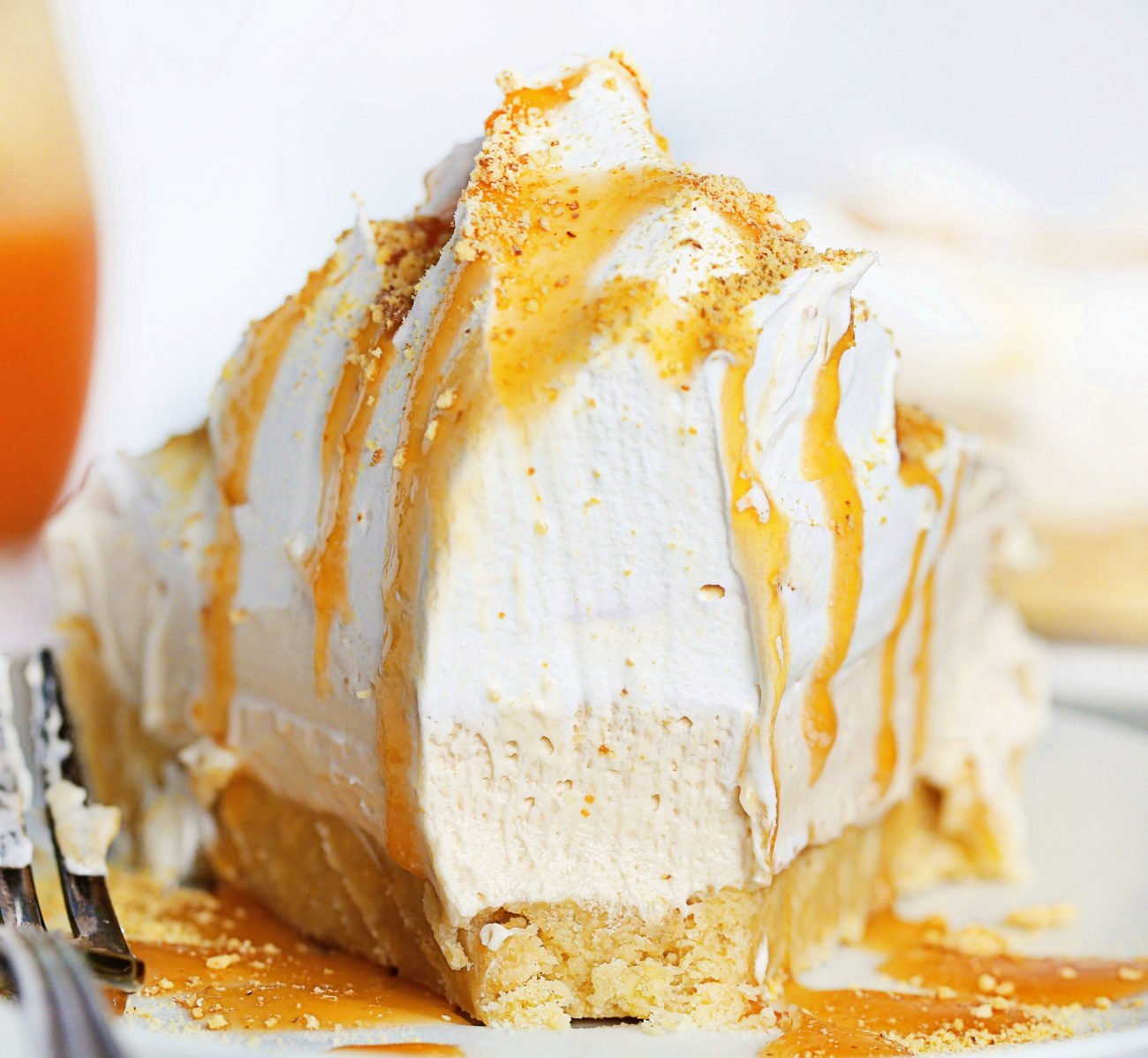 The best no-bake desserts to get your sweet tooth through the summer! no bake, no bake desserts, desserts, recipes, cheesecake, cookies, bars, cake, pudding, mousse, puppy chow, muddie buddies, rice krispy bars, dessert, memorial day dessert, labor day desserts, i am baker, iambaker No Bake Caramel Shortbread Pie with a Bite Removed.