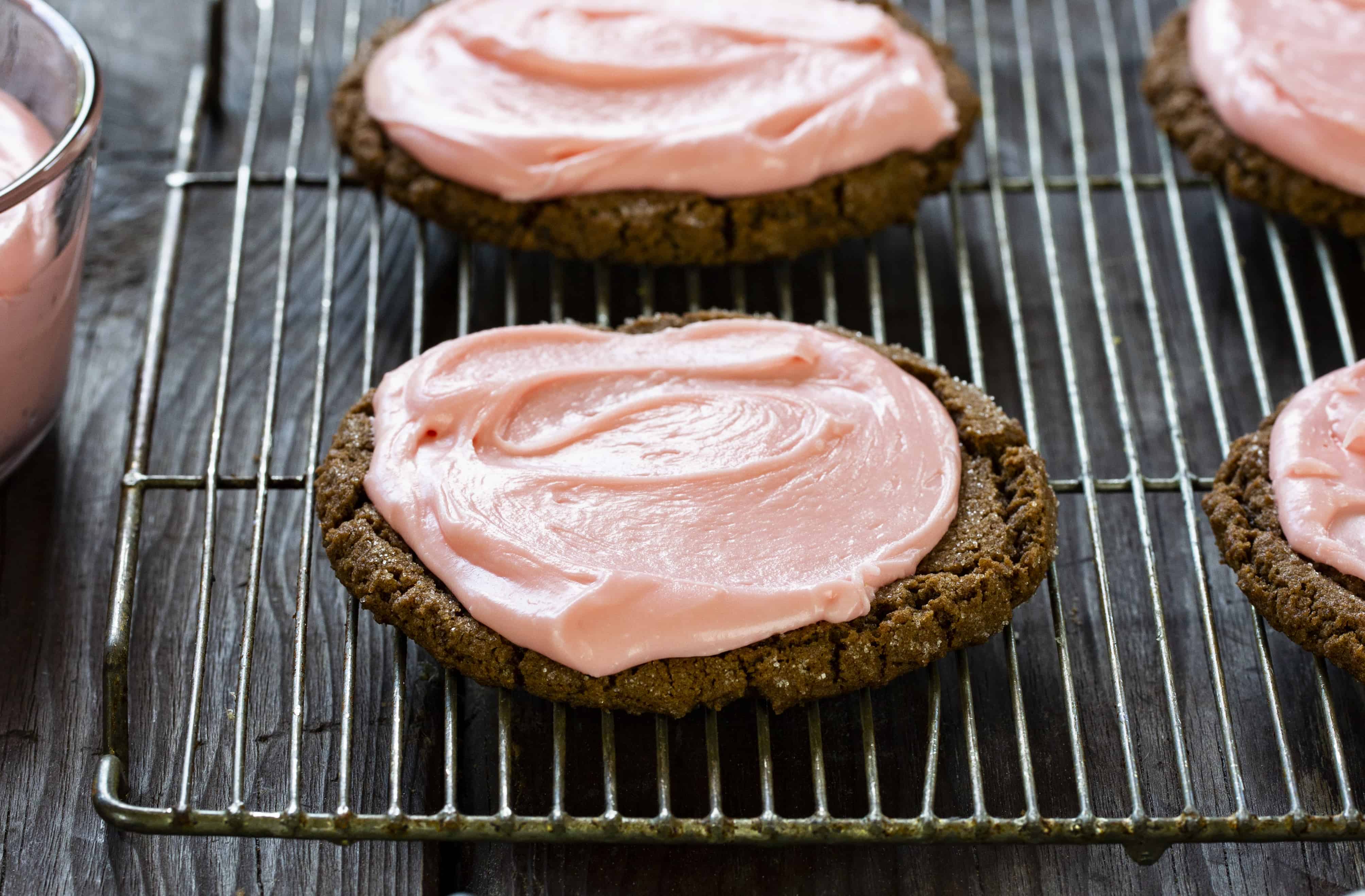 These fantastic chocolate cookies are paired with the most perfect chocolate frosting. Sometimes cherry frosting too! baking, cookies, cookie recipes, chocolate cookies, dirt ball cookies, iambaker Chocolate Cookies with Cherry Frosting