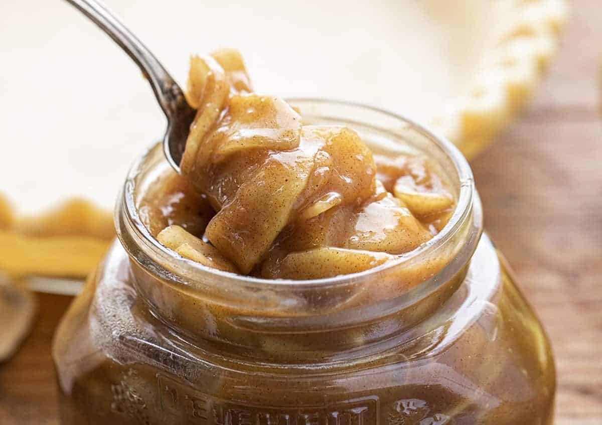 Apple Pie Filling is better than any pie filling you can buy at the store and is perfect for homemade apple pie, desserts, and even as a topping for ice cream! Apple Pie Filling, Pie Filling, How to Make Apple Pie Filling, Easy Apple Pie Filling, Pies, Baking, Cooking, Recipes, Apple Recipes, i am baker, iambaker Spoonful of Apple Pie Filling