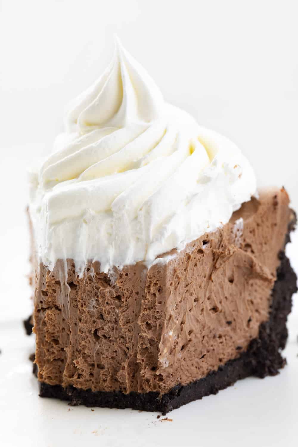 Baileys Chocolate Cream Pie is an adult dessert made with an Oreo cookie crust that is filled with a chocolate cheesecake flavored with Baileys Irish Cream. Baileys Pie Recipes, Baileys Chocolate Cream Pie, Chocolate Pie, No Bake Dessert, Oreo Pie Crust, Pie Recipes, Dessert, i am baker, iambaker, chocolate Bailey's Chocolate Cream Pie Recipe With Bite Removed