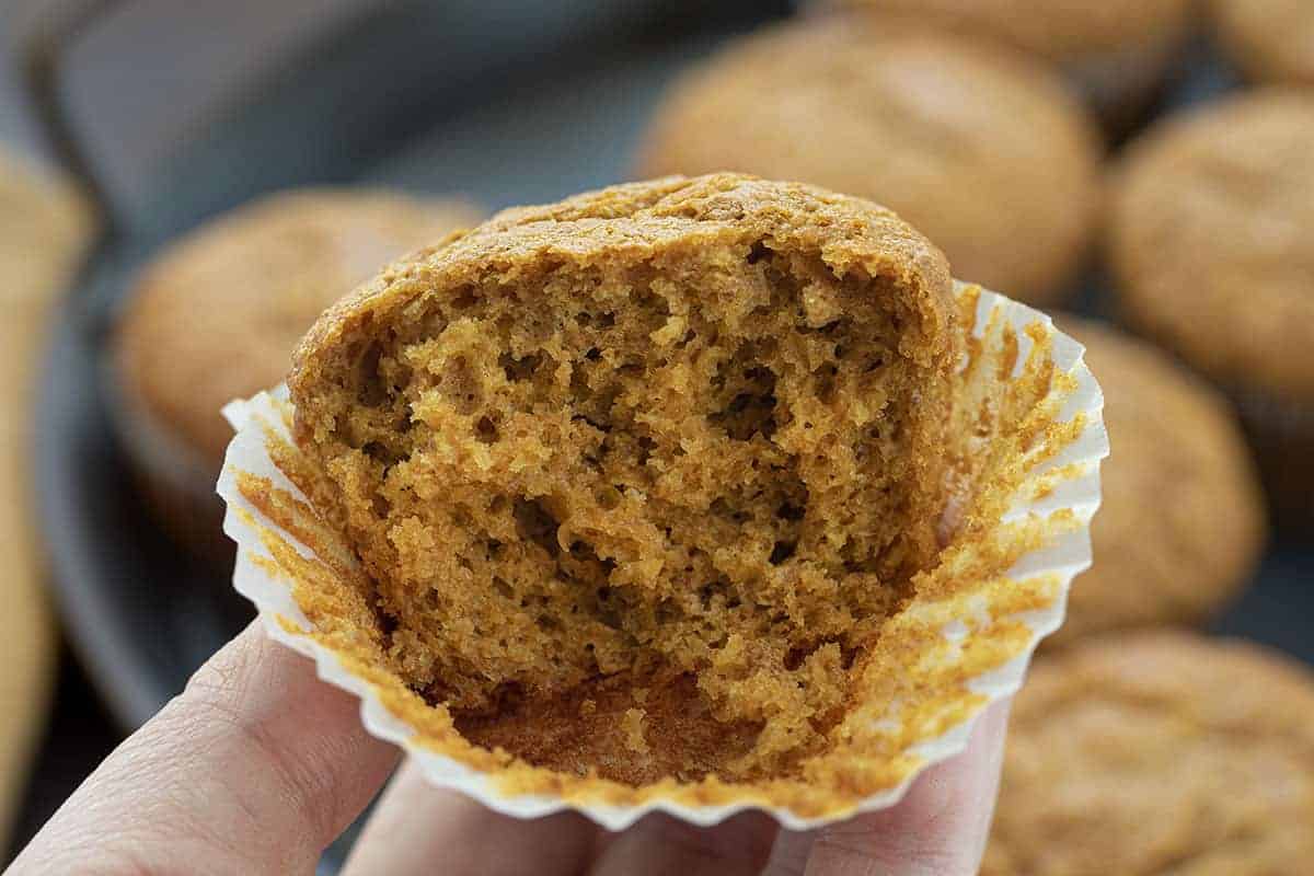 Bran Muffins are moist muffins that can be made with bran cereal or wheat bran and are a wonderful source of fiber to keep you feeling full all morning! Bran Muffin Recipe, Bran Muffins, Easy Bran Muffins, Breakfast, Muffin Recipes, Soft Bran Muffins, Moist Bran Muffins, recipes, i am baker, iambaker Hand Holding Half a Bran Muffin