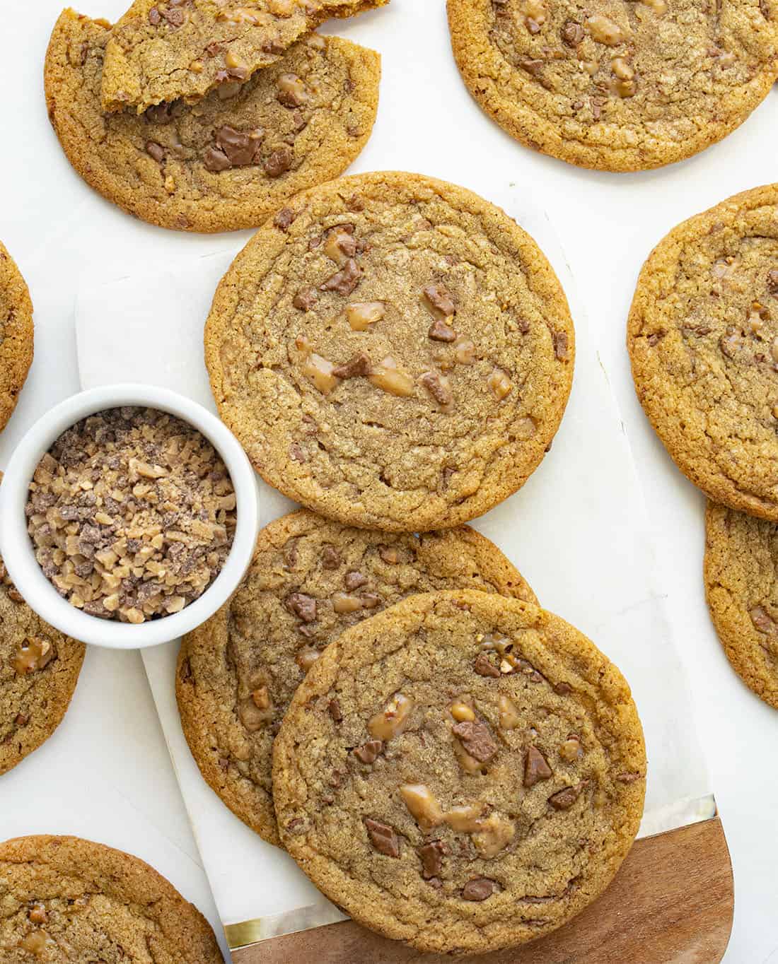 Browned Butter Toffee Cookies are chewy cookies with crispy edges that are made with browned butter and loaded with Heath Milk Chocolate and English Toffee bits. Cookies, Brown Butter Cookies, Cookie Recipes, Toffee Cookies, Dessert, Baking, i am baker, iambaker Overhead of Brown Butter Toffee Cookies Recipe