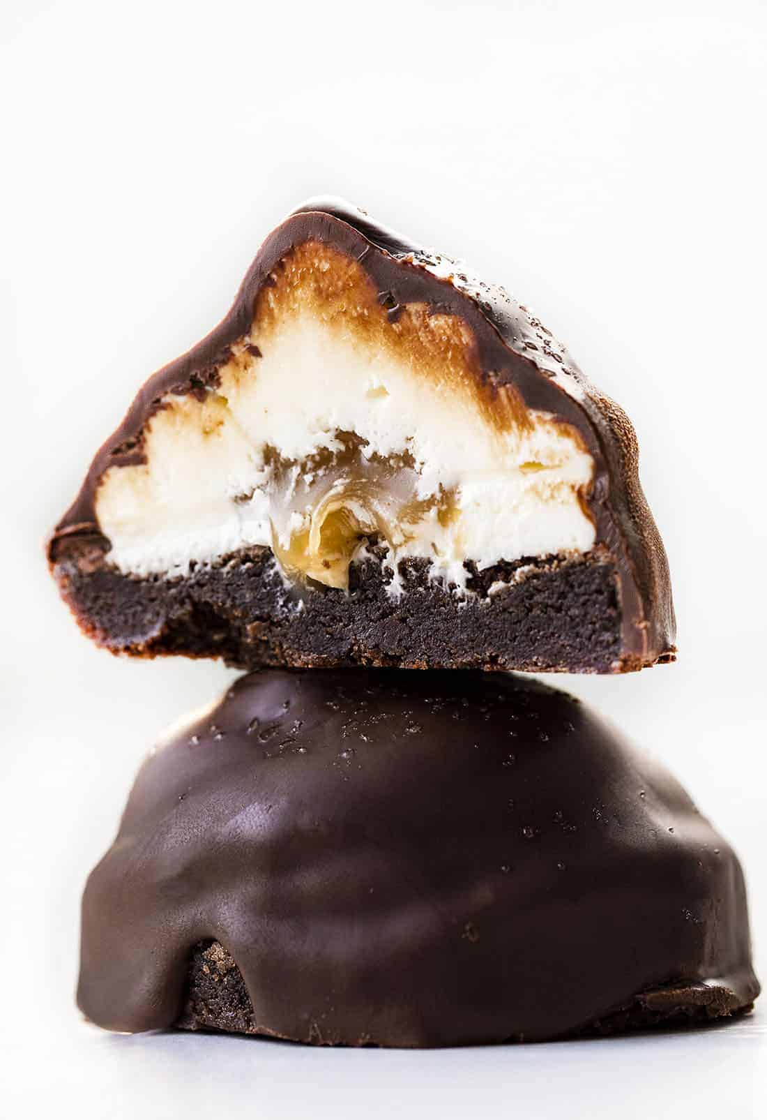 Salted Caramel Brownie Marshmallow Hi-Hats are brownies piled high with marshmallow buttercream and a caramel center that are then coated with melted chocolate and sprinkled with sea salt. Hi Hat, Brownie Treats, Brownie Dessert, Desserts, Chocolate Dessert, Salted Caramel, Marshmallow Buttercream, Salted Caramel Chocolate Hi-Hat, i am baker, iambaker Stacked Salted Caramel Brownie Hi-Hat