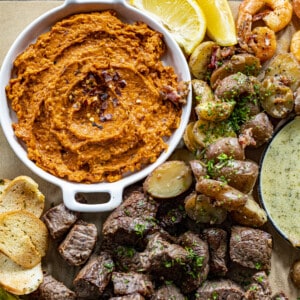 Spicy Butter on a Butter Board with Steak and Potatoes. Charcuterie, Butter Board, Viral Butter Boards, Tiktok Butter Board, How to Make a Butter Board, Appertizer, Dinner, Surf & Turf, Compound Butters, Superbowl Food, i am baker, iambaker