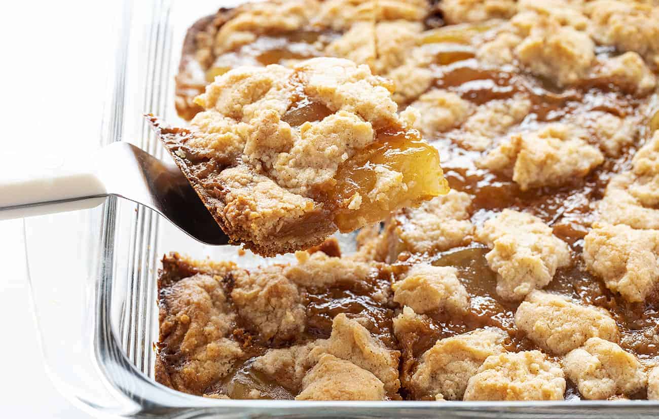 Satisfy everyone's sweet tooth with this Caramel Apple Dump cake--easy to make and to eat, for sure! caramelappledumpcake, caramelapple, desserts, iambaker, dumpcake, baking, thanksgivingdesserts, falldesserts One piece from a pan of Caramel Apple Dump Cake