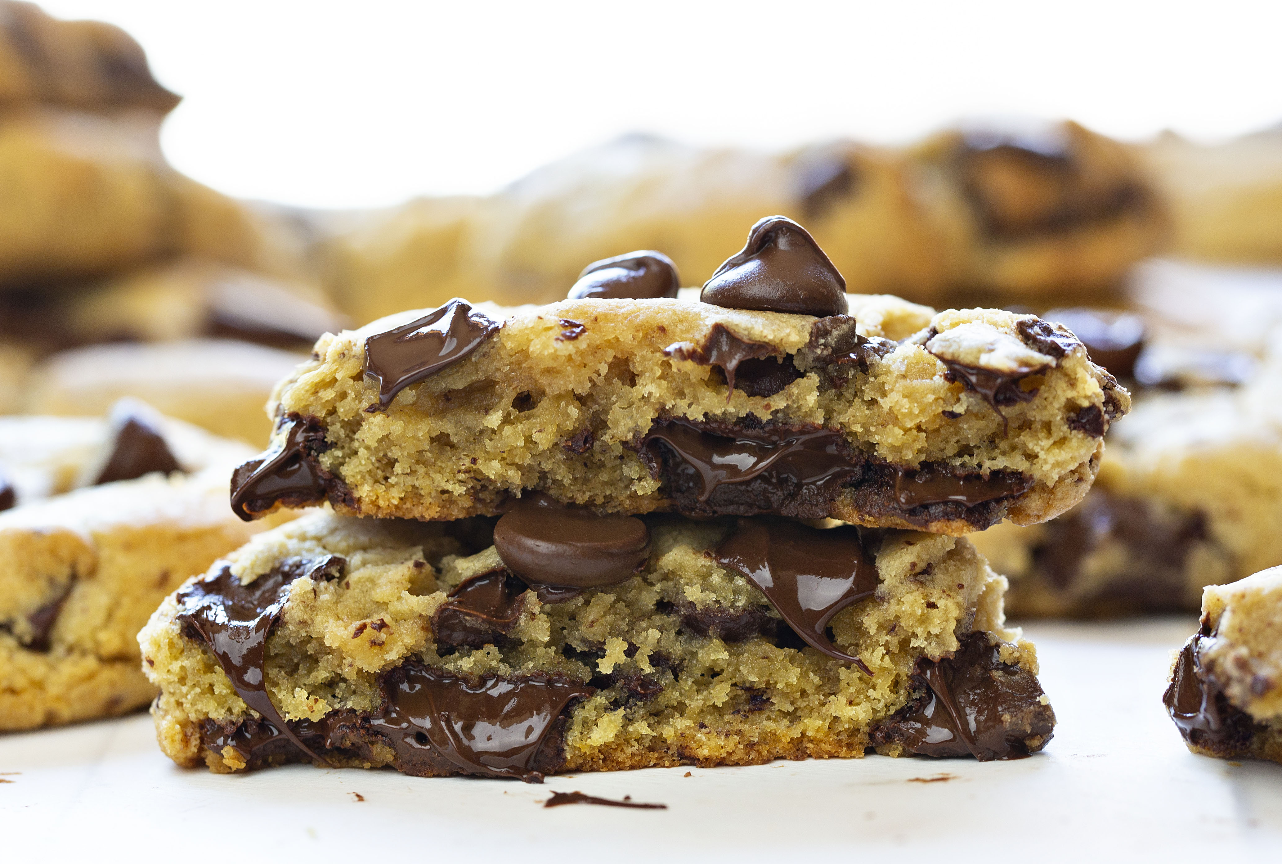 These are the PERFECT Chocolate Chip Cookie. Tried and tested over 500 times! #chocolatechipcookies #chocolatecookies #howtomakechocolatechipcookies #thebestchocoaltechipcookies #chocolatechipcookierecipe #baking #iambaker #recipes #cookierecipes Broken in Half Chocolate Chip Cookies