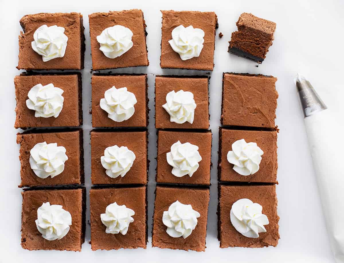 Chocolate Cheesecake Bars are creamy and chocolatey dessert bars with an Oreo cookie crust and homemade chocolate whipped topping. Chocolate Cheesecake, Cheesecake Bars, Chocolate Cheesecake Bars, Chocolate Bars, Triple Chocolate Bars, Dessert, Chocolate Dessert, Baking, i am baker, iambaker, recipes Chocolate Cheesecake Bars Cut Into Squares