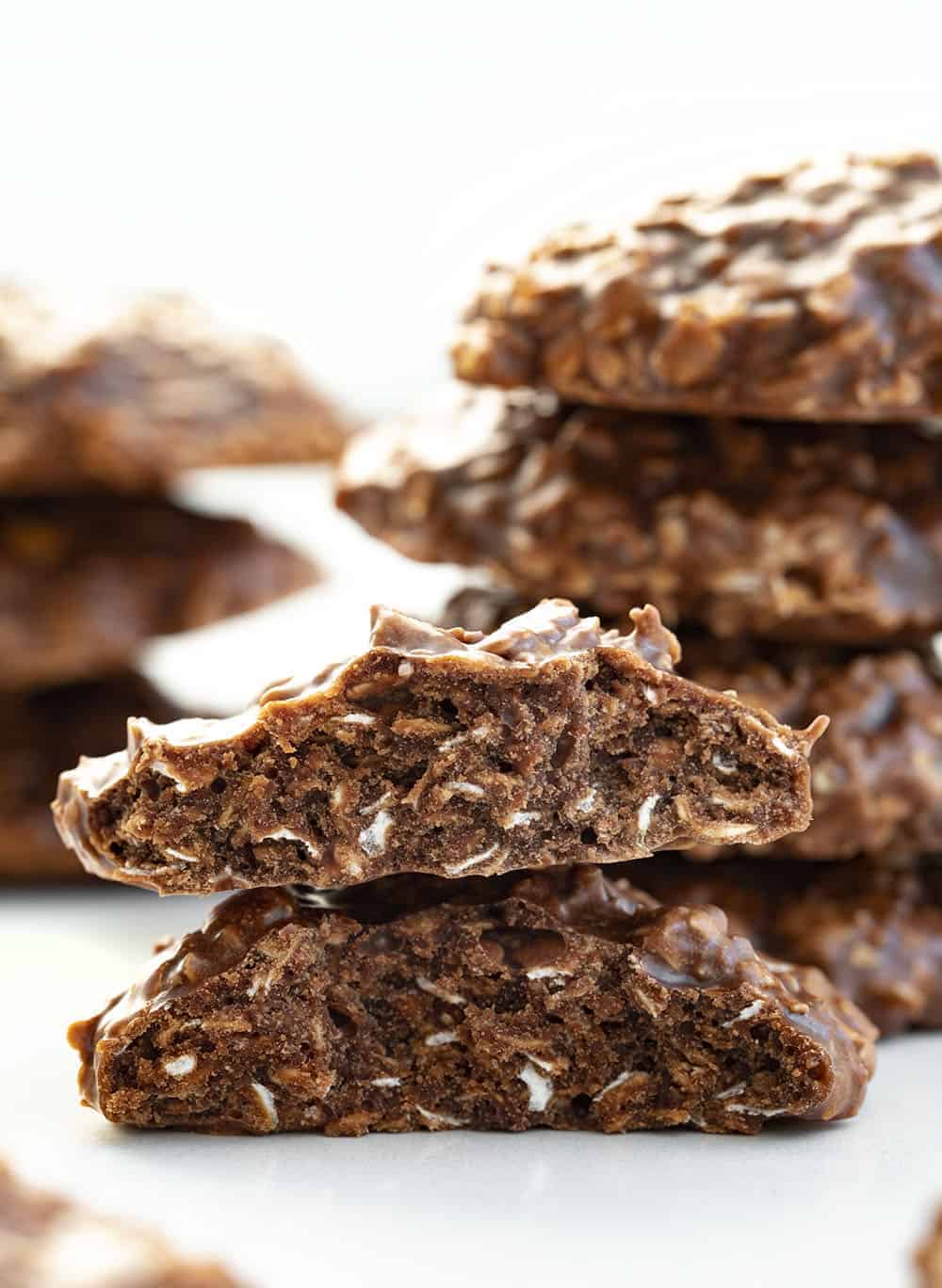 Chocolate Peanut Butter Cookies {No Bake} are a no-bake treat made with quick oats, cocoa, and creamy peanut butter for a quick, but flavorful cookie. No Bake Cookies, Recipes, Cookies, Chocolate, No Bake, Dessert, Easy Cookie Recipes, i am baker, iambaker, breakfast cookie Split in Half Chocolate Peanut Butter Oatmeal No Bake Cookies
