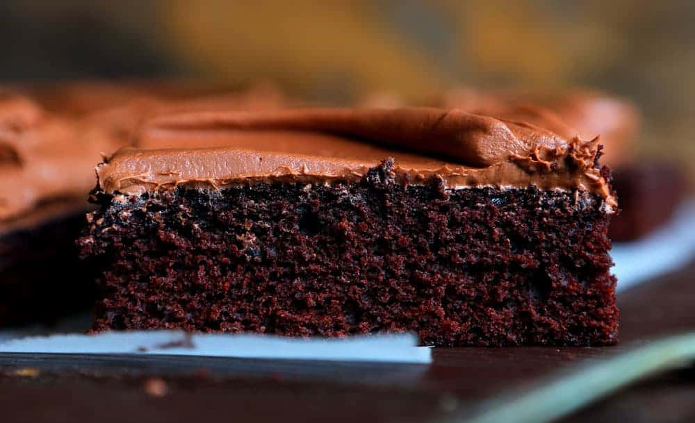 If you are looking for a UNIQUE recipe that packs a chocolate punch, this is the recipe for you! #chocolatecake #oldfashionedchocolatecake #recipes #baking #chocolate #perfectchocolatecake #chocolatefrosting #creamychocolatefrosting #iambaker One piece of Chocolate Cake