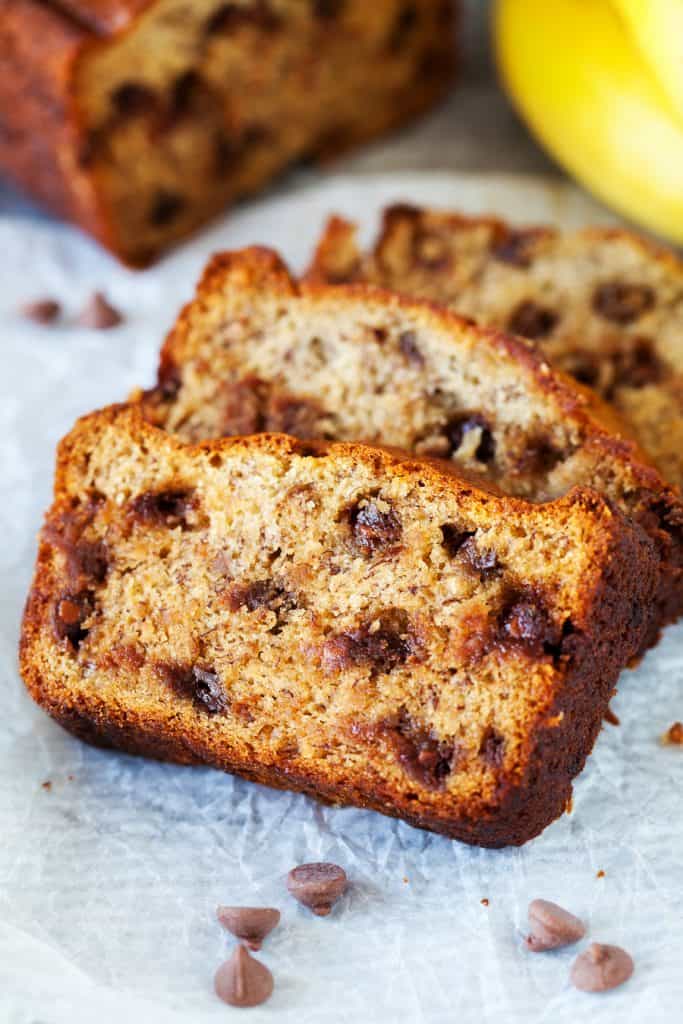 The BEST Chocolate Chip Banana Bread!! If you love bananas you have to try this! banana bread, chocolate chip banana bread, easy banana cream, iamhomesteader, iambaker, baking, quick bread Slices of Chocolate Chip Banana Bread
