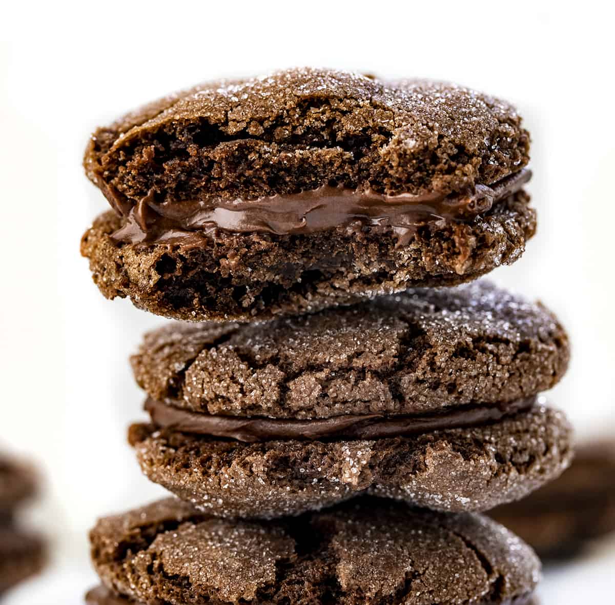 Chocolate Sandwich Cookies are soft, chewy, sugary chocolate cookies with a layer of decadent chocolate frosting in between. It's a chocolate lovers dream! Stack of Chocolate Sandwich Cookies.