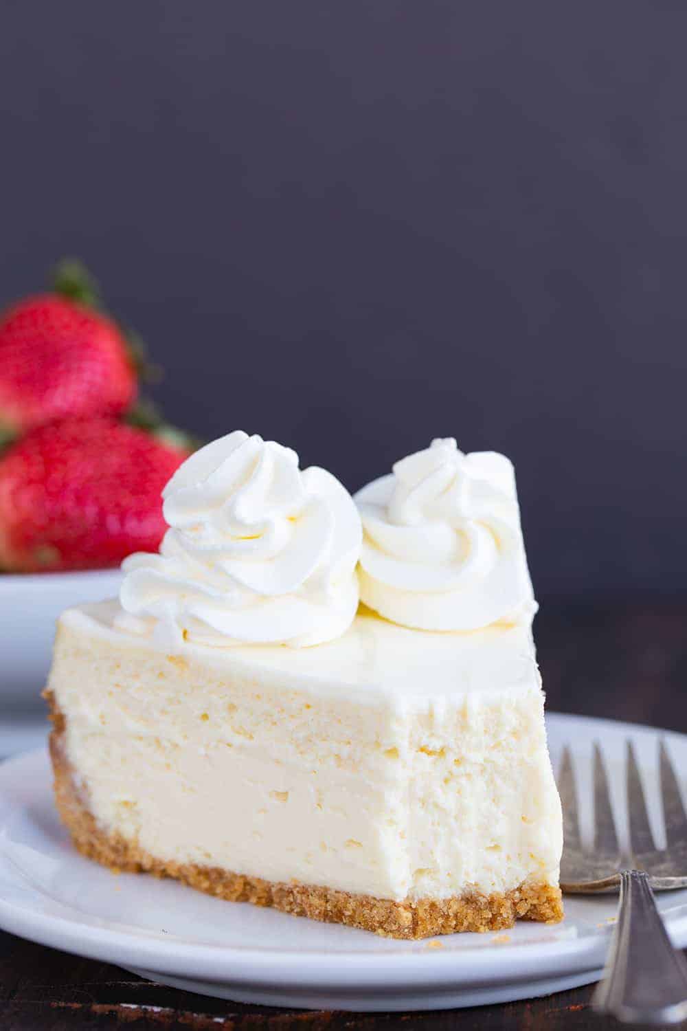 A classic cheesecake recipe that you will use again and again. The topping is what makes it over-the-top special! #cheesecake #cheesecakerecipe #howtobakecheesecake #easycheesecake #classiccheesecake #iambaker Cheesecake