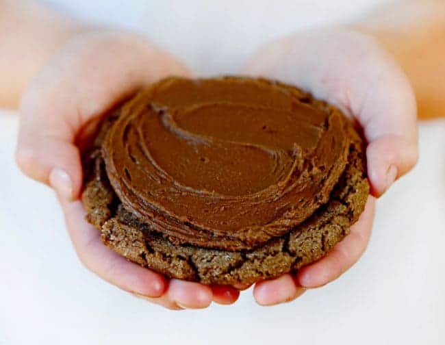 These fantastic chocolate cookies are paired with the most perfect chocolate frosting. Sometimes cherry frosting too! baking, cookies, cookie recipes, chocolate cookies, dirt ball cookies, iambaker Dirty Chocolate Cooking in hands