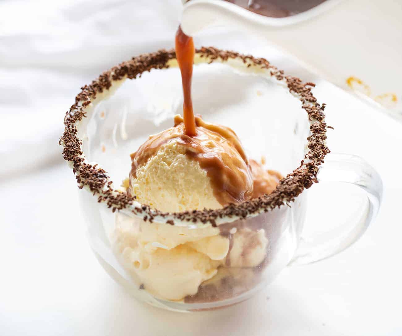 The ultimate cocktail!! Easy ingredients and so refreshing! Drunken Snowman, Cocktails, Alcohol, New Years Eve Drink Idea, Cocktail Ideas, drink ideas for NYC, how to make a drink, i am baker Pouring Hot Chocolate Over Ice Cream to make a Drunken Snowman Drink
