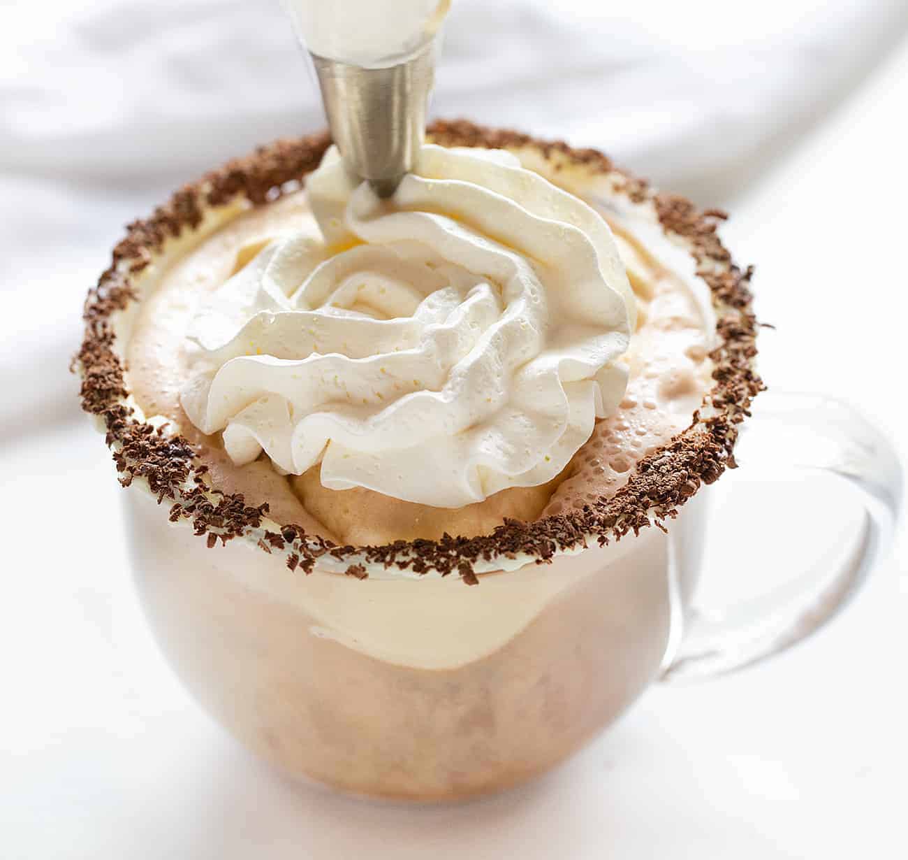 The ultimate cocktail!! Easy ingredients and so refreshing! Drunken Snowman, Cocktails, Alcohol, New Years Eve Drink Idea, Cocktail Ideas, drink ideas for NYC, how to make a drink, i am baker Adding Whipped Topping to a Hot Chocolate Drink