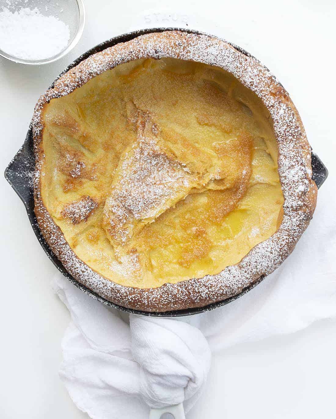 Dutch Baby Pancakes, also known as German or Puff pancakes, is like a combination of a crepe, a pancake, and a popover, all in one. It's a wonderful breakfast or brunch treat. Dutch Baby, German Pancake, Breakfast, recipes, i am baker, iambaker Overhead of Dutch Baby Pancake in Pan