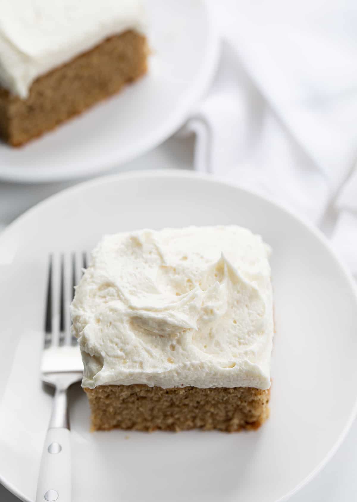 Ermine Frosting, also known as milk frosting, flour buttercream, flour frosting, or $300 Dollar Icing is a silky smooth frosting made from a cooked milk and flour mixture, sugar, and butter. It is made without eggs and is traditionally used to frost red velvet cake. But, don't stop there; its light and airy texture is perfect as a topping for a variety of cakes and cupcakes! Pieces of Spice Cake Covered in Ermine - $300 Frosting.