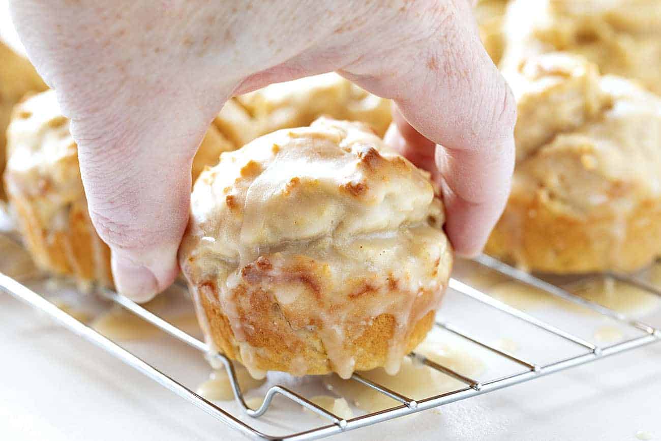No need to decide between a donut or a muffin when you get both in these tasty Pumpkin Spice Donut Muffins! old fashioned pumpkin spice donut muffins, pumpkin spice donut muffins, iambaker, muffins,baking homemade pumpkin pie spice, pumpkin spice, fall treats, coffee break Hand picking up Old Fashioned Pumpkin Spice Donut Muffins