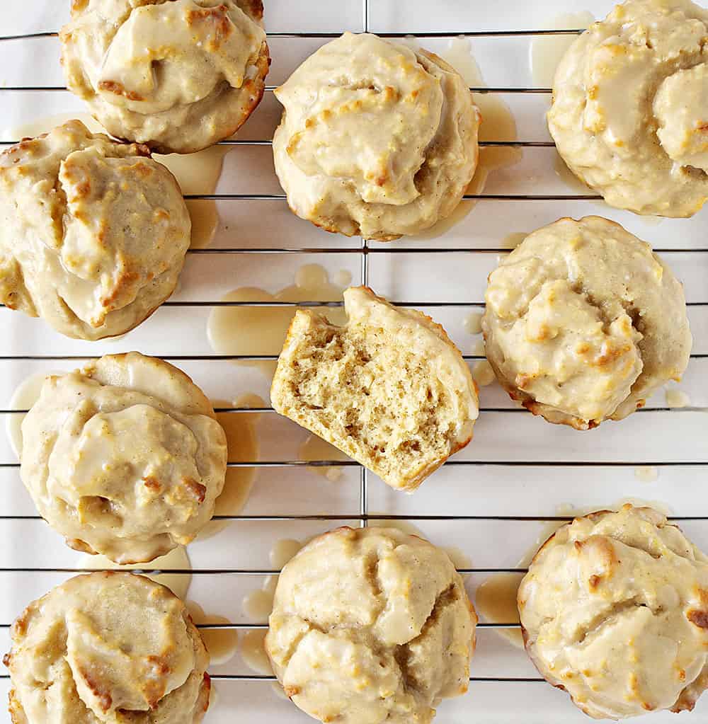 No need to decide between a donut or a muffin when you get both in these tasty Pumpkin Spice Donut Muffins! old fashioned pumpkin spice donut muffins, pumpkin spice donut muffins, iambaker, muffins,baking homemade pumpkin pie spice, pumpkin spice, fall treats, coffee break Overhead View of Old Fashioned Pumpkin Spice Donut Muffins with one broke open