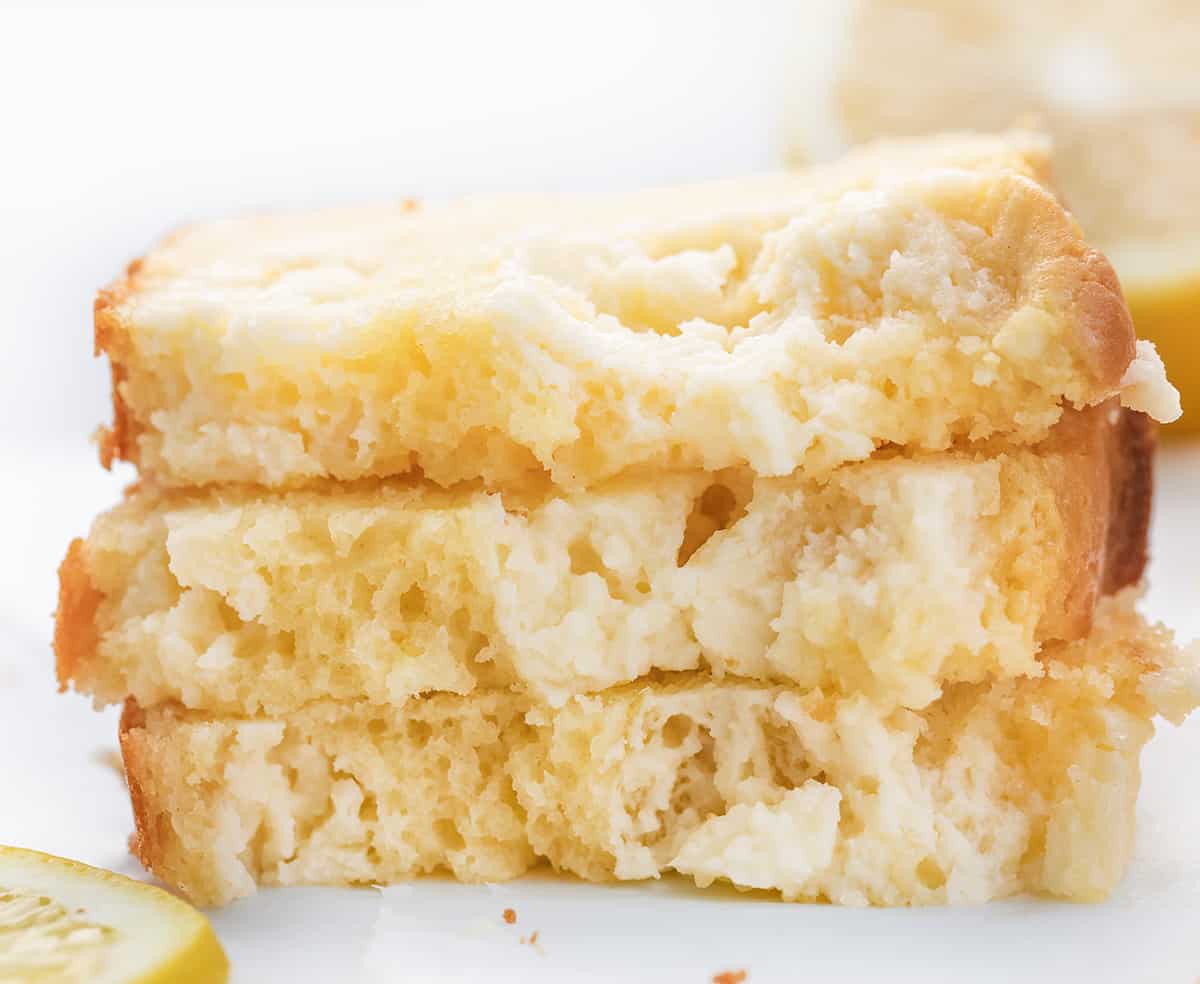 Lemon Cream Cheese Loaf is a moist and tender cake bursting with lemon flavor with a rich cream cheese swirl. It is delicious and visually stunning, with a beautiful marbled pattern from the swirl. It's a delightful option for breakfast, brunch, a sweet snack, or dessert! Stacked Slices of Lemon Cream Cheese Loaf.