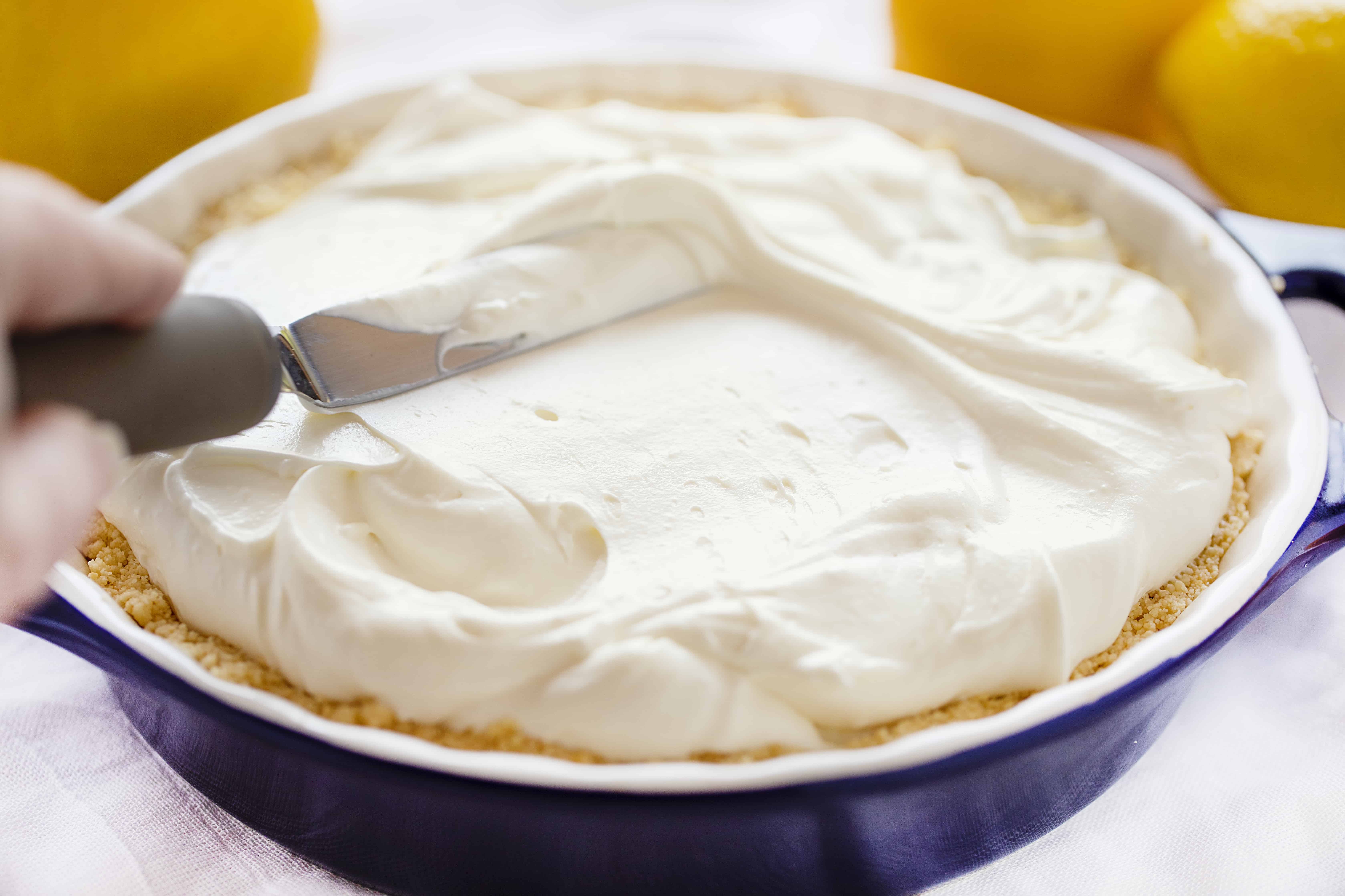 This No Bake Lemon Cream Pie is smooth, velvety, and has the perfect amount of lemon! Super easy to make! #lemoncreampie #lemonpie #nobakedessert #summerdesserts #easydesserts #lemondesserts #iambaker #lemonmousse #nobakepie How to Make Lemon Cheesecake Cream Pie