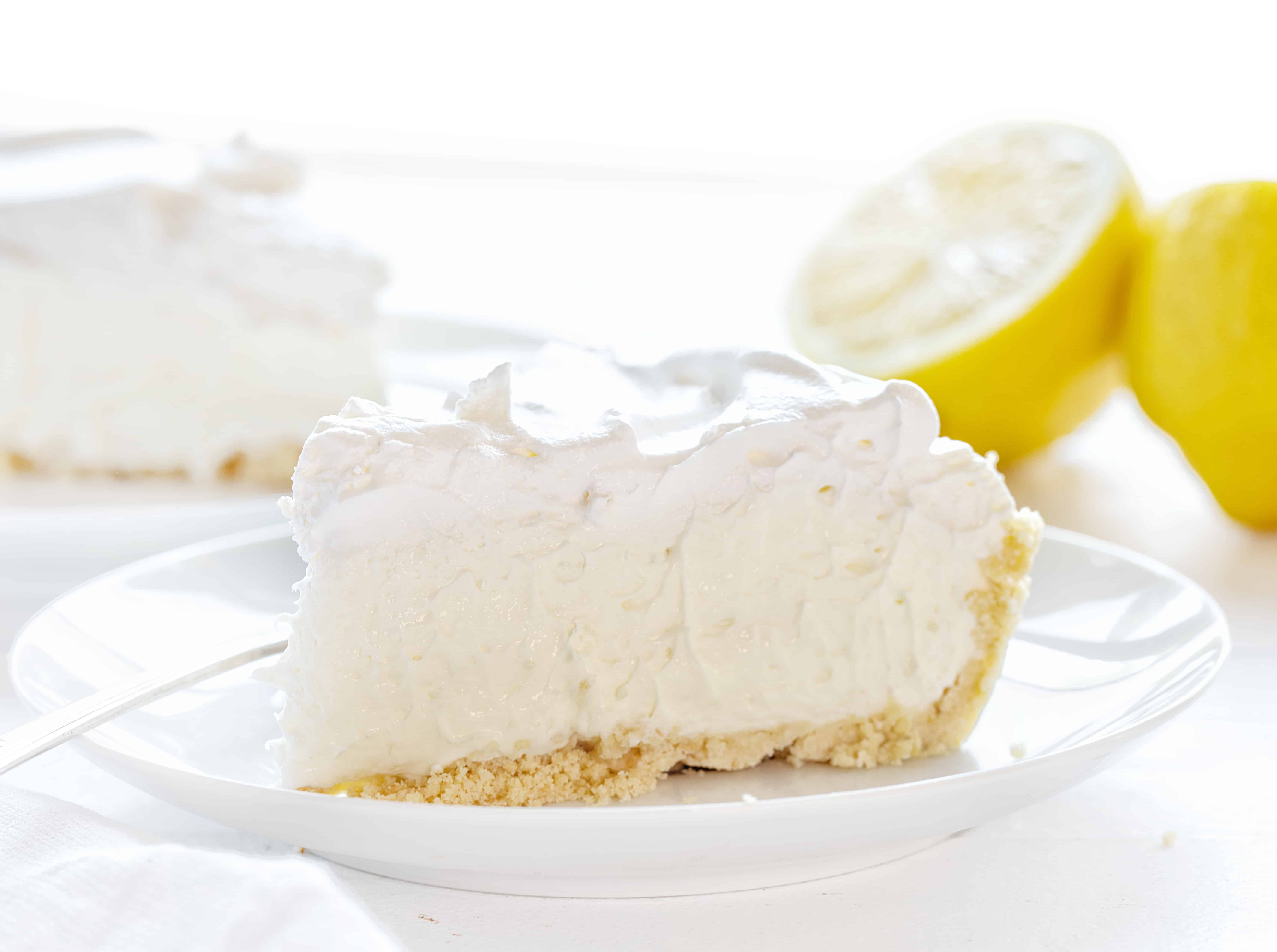 This No Bake Lemon Cream Pie is smooth, velvety, and has the perfect amount of lemon! Super easy to make! #lemoncreampie #lemonpie #nobakedessert #summerdesserts #easydesserts #lemondesserts #iambaker #lemonmousse #nobakepie Easy Lemon Cheesecake Cream Pie