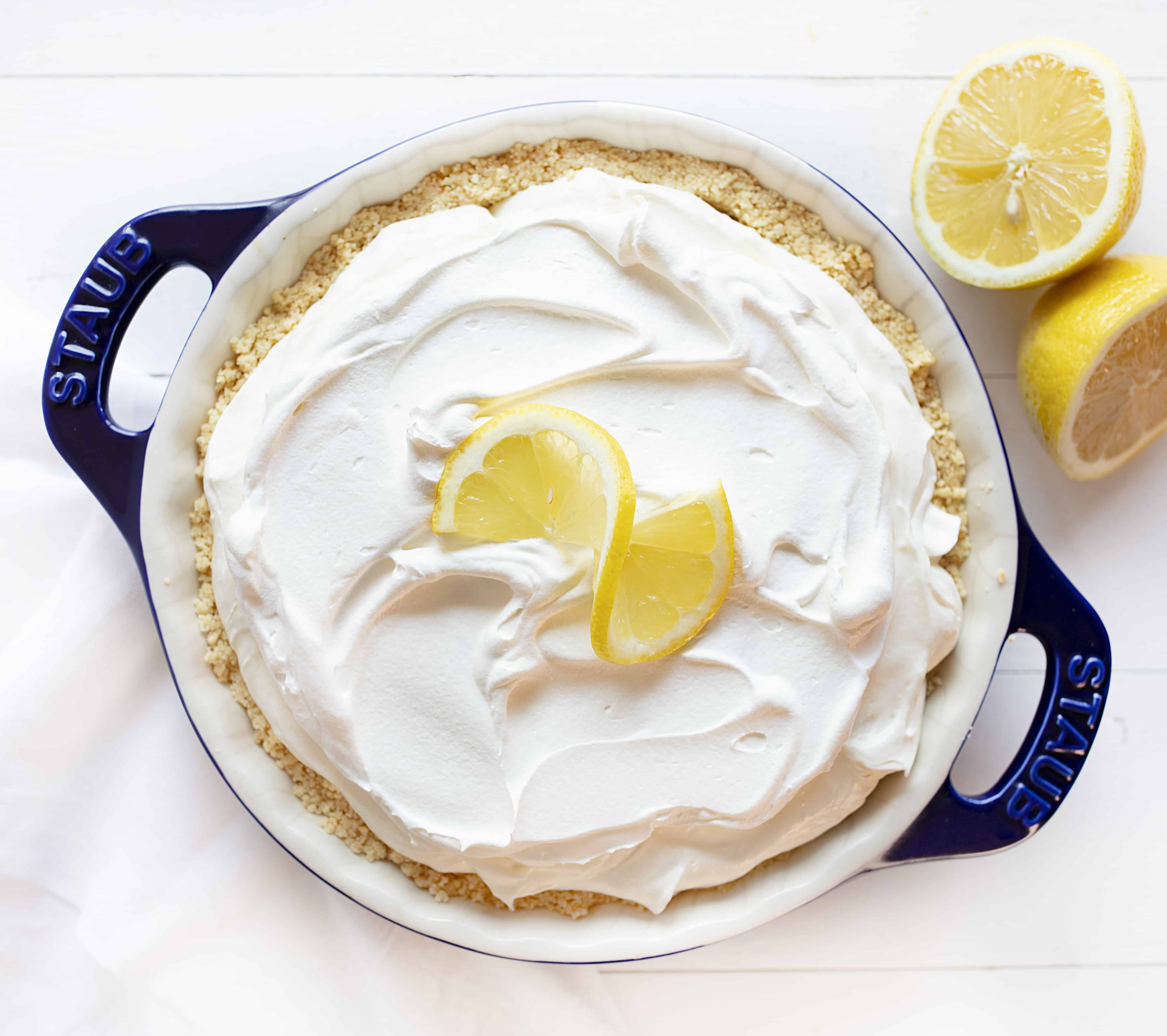 This No Bake Lemon Cream Pie is smooth, velvety, and has the perfect amount of lemon! Super easy to make! #lemoncreampie #lemonpie #nobakedessert #summerdesserts #easydesserts #lemondesserts #iambaker #lemonmousse #nobakepie No Bake Lemon Cheesecake Cream Pie