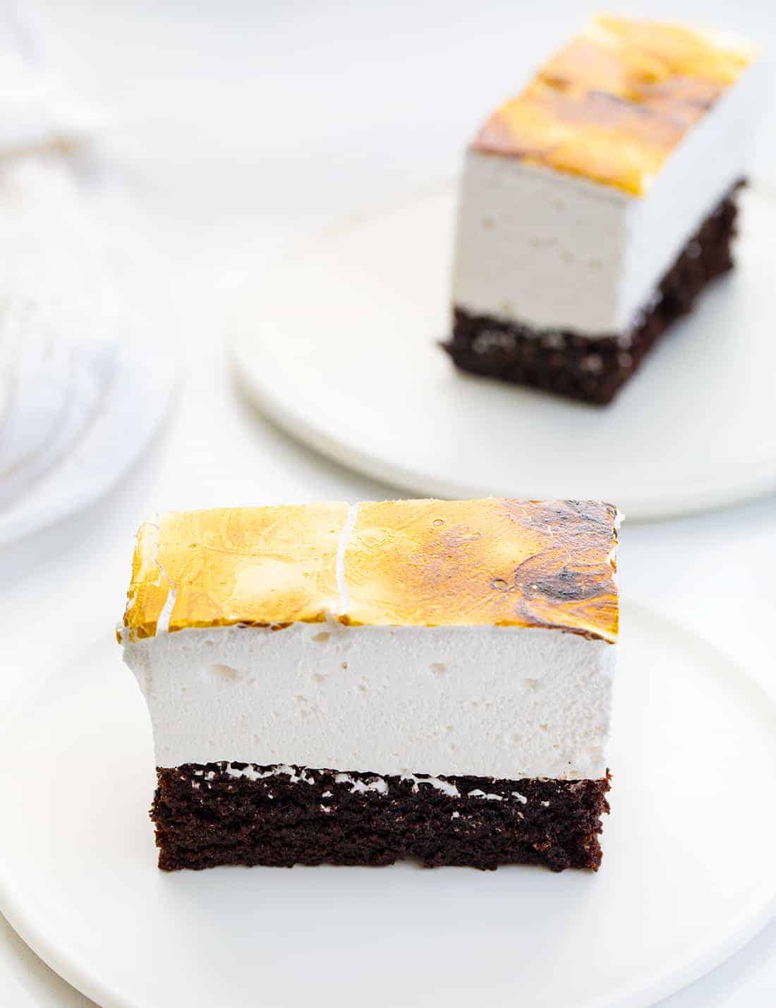 Toasted Marshmallow Brownies are a layer of baked brownies that are topped with homemade marshmallow that is toasted to a golden brown. Brownie Recipes, Homemade Marshmallow, How to Make Marshmallow, Toasted Marshmallow, Baking, Dessert, BBQ Dessert, cookout desserts, campfire, recipes, i am baker, iambaker Toasted Marshmallow Brownies on Plates