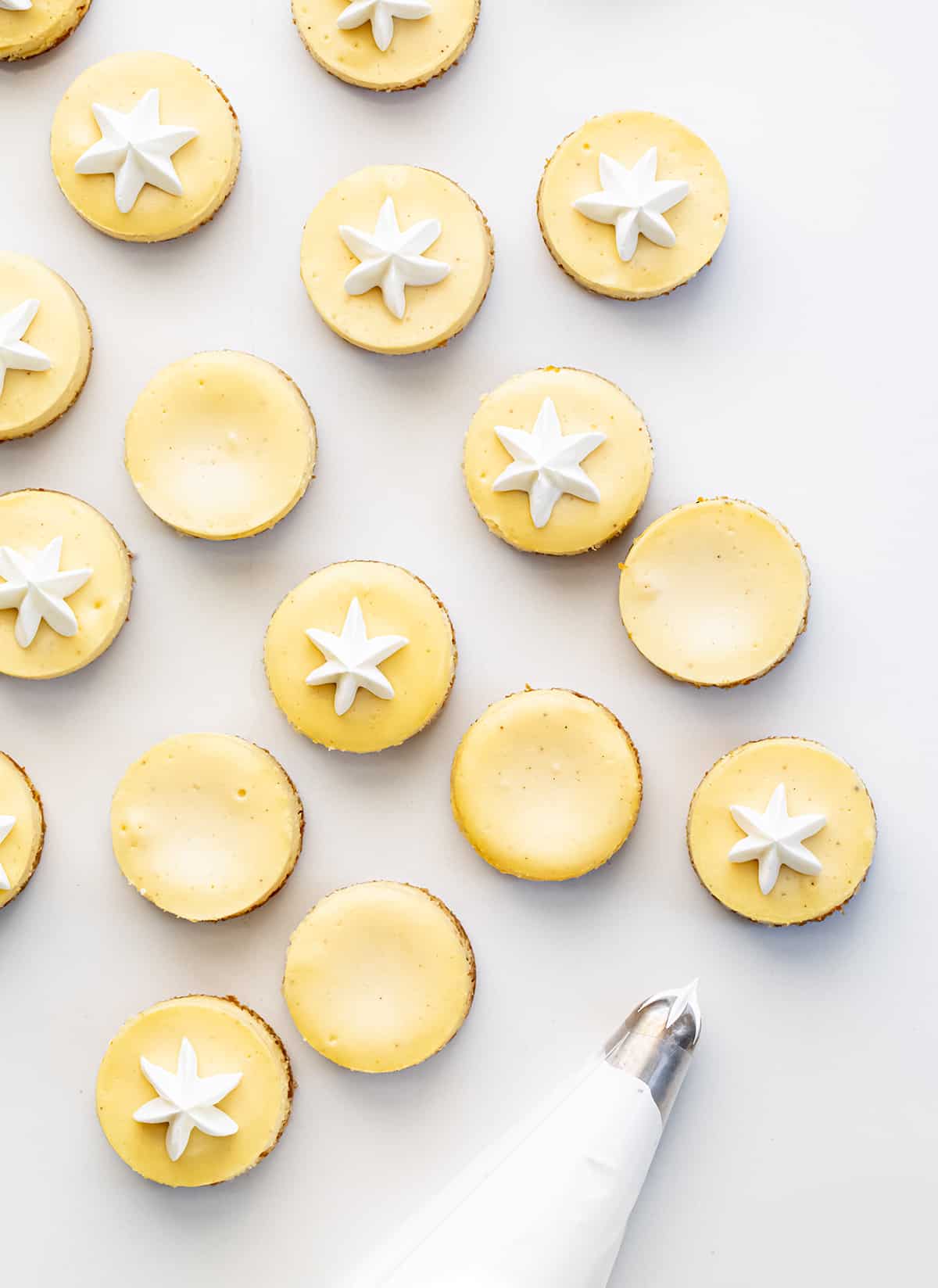 With the holidays here, the more snacks, desserts, and appetizers you can make, the better! These mini eggnog cheesecakes cover all the bases. They are easy finger food, they can be added to a Christmas dessert charcuterie board (all the rage right now), and are also perfect New Year's Eve appetizers! In addition, it doesn't get more festive than using eggnog in the mini cheesecakes.