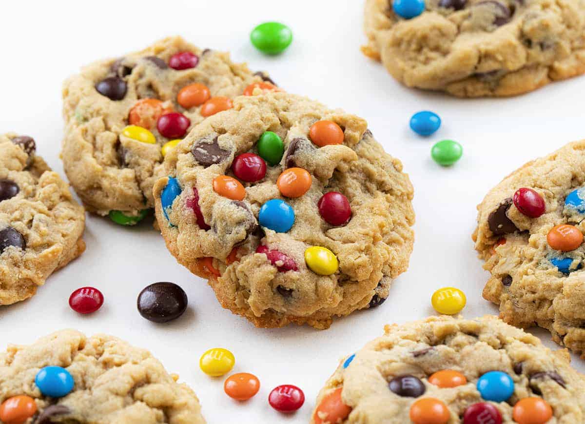 Soft Batch Monster Cookies are a cross between a soft peanut butter cookie and an oatmeal cookie that is loaded with peanut butter, oats, M&M's, and chocolate chips. Cookies, Baking, Monster Cookies, M&M Cookies, Cookie Recipes, i am baker, iambaker, dessert M&M Soft Batch Monster Cookies