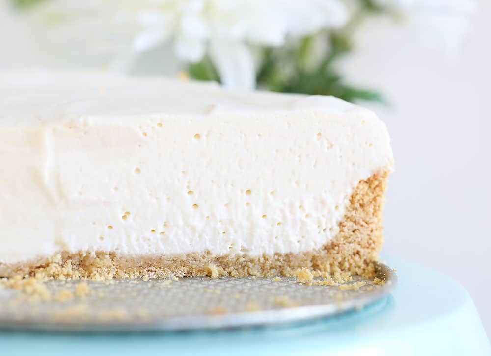 Are you are craving the silky smooth delightfulness that is Cheesecake but don't want to turn on your oven? I have found the perfect No-Bake Cheesecake recipe for you! #nobake #dessert #cheesecake #nobakecheesecake #recipes #cheesecake #iambaker Close up picture of inside of Cheesecake