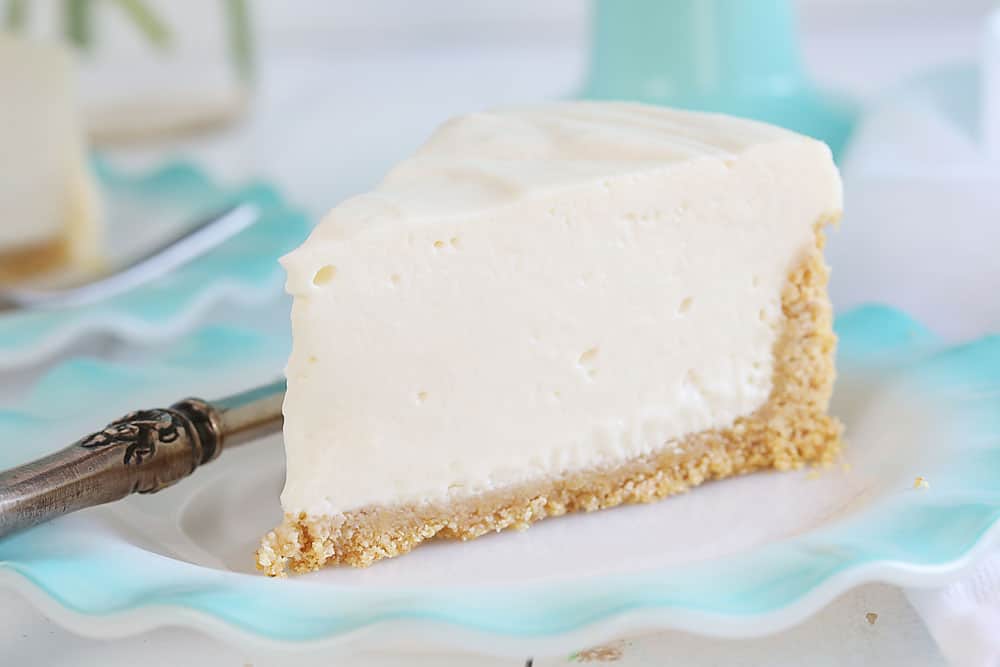 Are you are craving the silky smooth delightfulness that is Cheesecake but don't want to turn on your oven? I have found the perfect No-Bake Cheesecake recipe for you! #nobake #dessert #cheesecake #nobakecheesecake #recipes #cheesecake #iambaker One Piece of No Bake Cheesecake