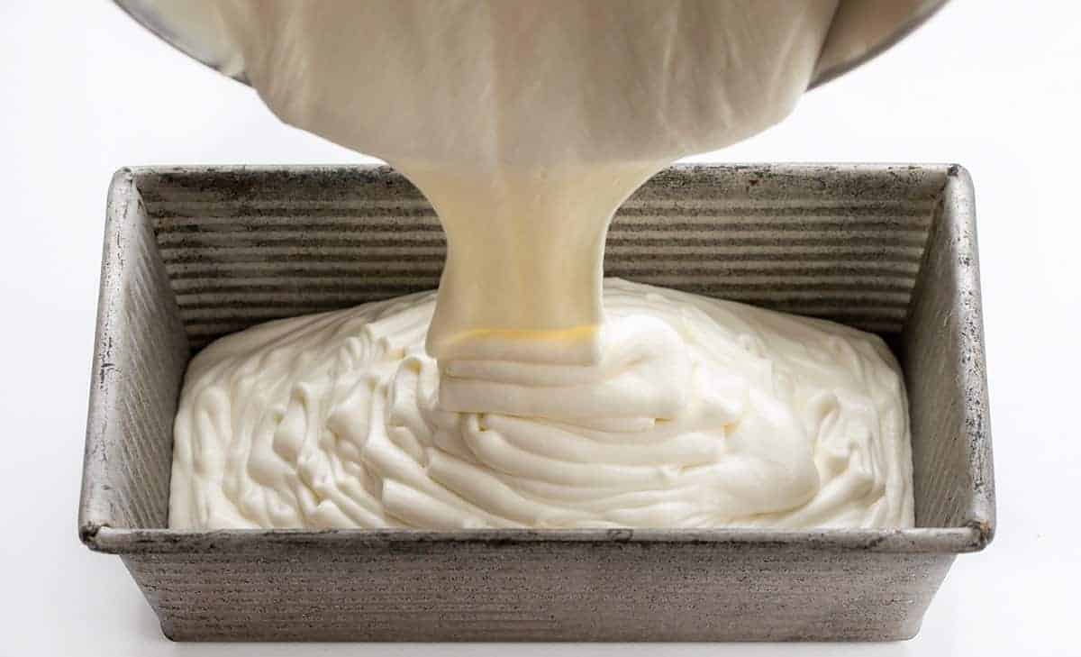 No Churn Vanilla Ice Cream or Four Ingredients Ice Cream. There is no special equipment needed to make this batch of fantastic homemade vanilla ice cream. Ice Cream Recipes, Ice Cream, Vanilla Ice Cream Recipes, How to Make Ice Cream, Food Photography, Ice Cream Food Photography, Homemade Ice Cream with No Machine, dessert, no bake dessert, BBQ Dessert, Cookout Dessert, i am baker, iambaker Pouring No Churn Vanilla Ice Cream into Pan Before It's Been Frozen