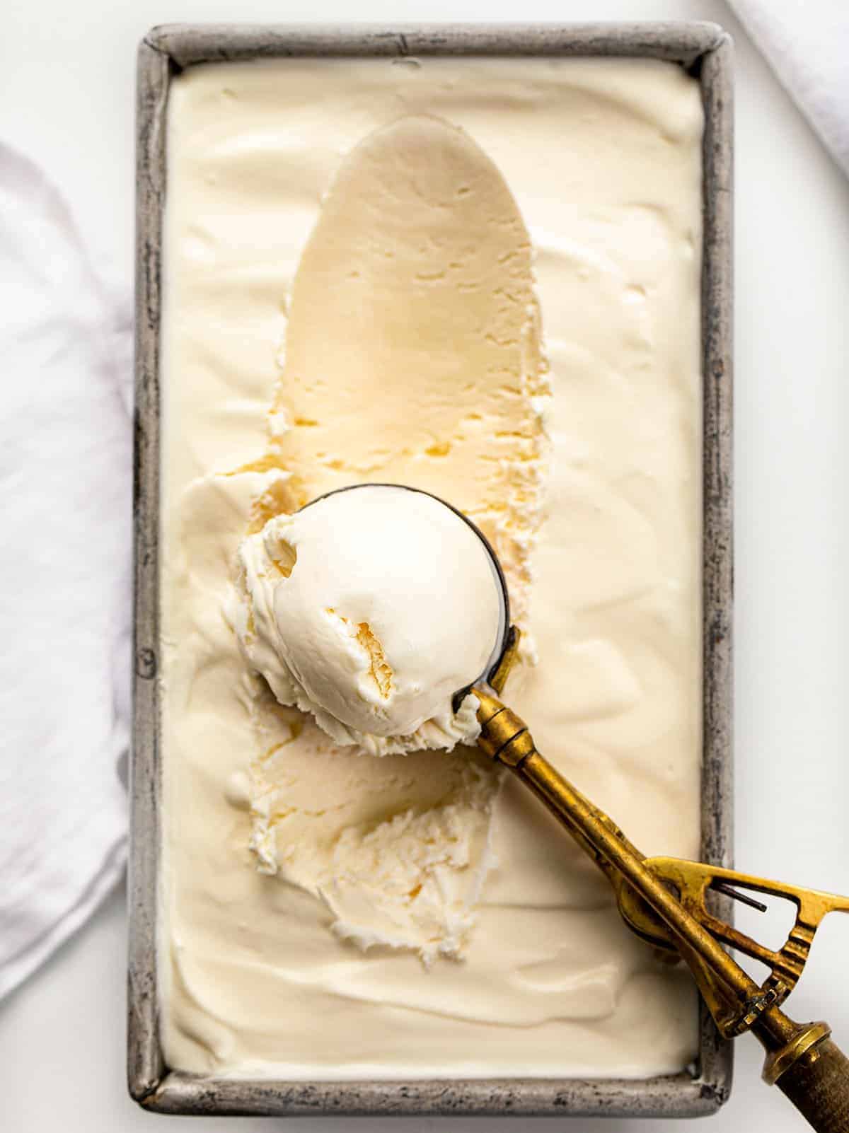 No Churn Vanilla Ice Cream or Four Ingredients Ice Cream. There is no special equipment needed to make this batch of fantastic homemade vanilla ice cream. Ice Cream Recipes, Ice Cream, Vanilla Ice Cream Recipes, How to Make Ice Cream, Food Photography, Ice Cream Food Photography, Homemade Ice Cream with No Machine, dessert, no bake dessert, BBQ Dessert, Cookout Dessert, i am baker, iambaker Ice Cream Scoop Filled with Ice Cream for No Churn Ice Cream Recipe - 4 Ingredient Ice Cream