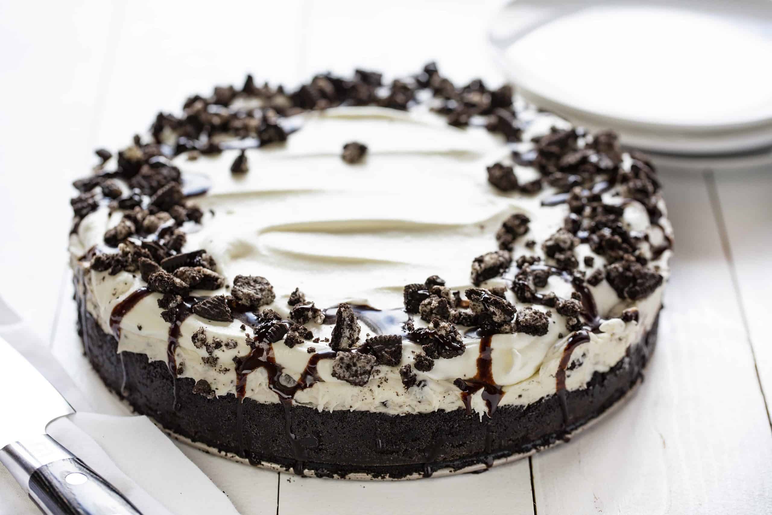 No Bake Oreo Cheesecake is so delicious no one will believe you didnt bake it! no bake, no bake desserts, cheesecake, no bake cheesecake, oreo, oreo cheesecake, no bake oreo cheesecake, iambaker Full, Uncut No Bake Oreo Cheesecake on Table