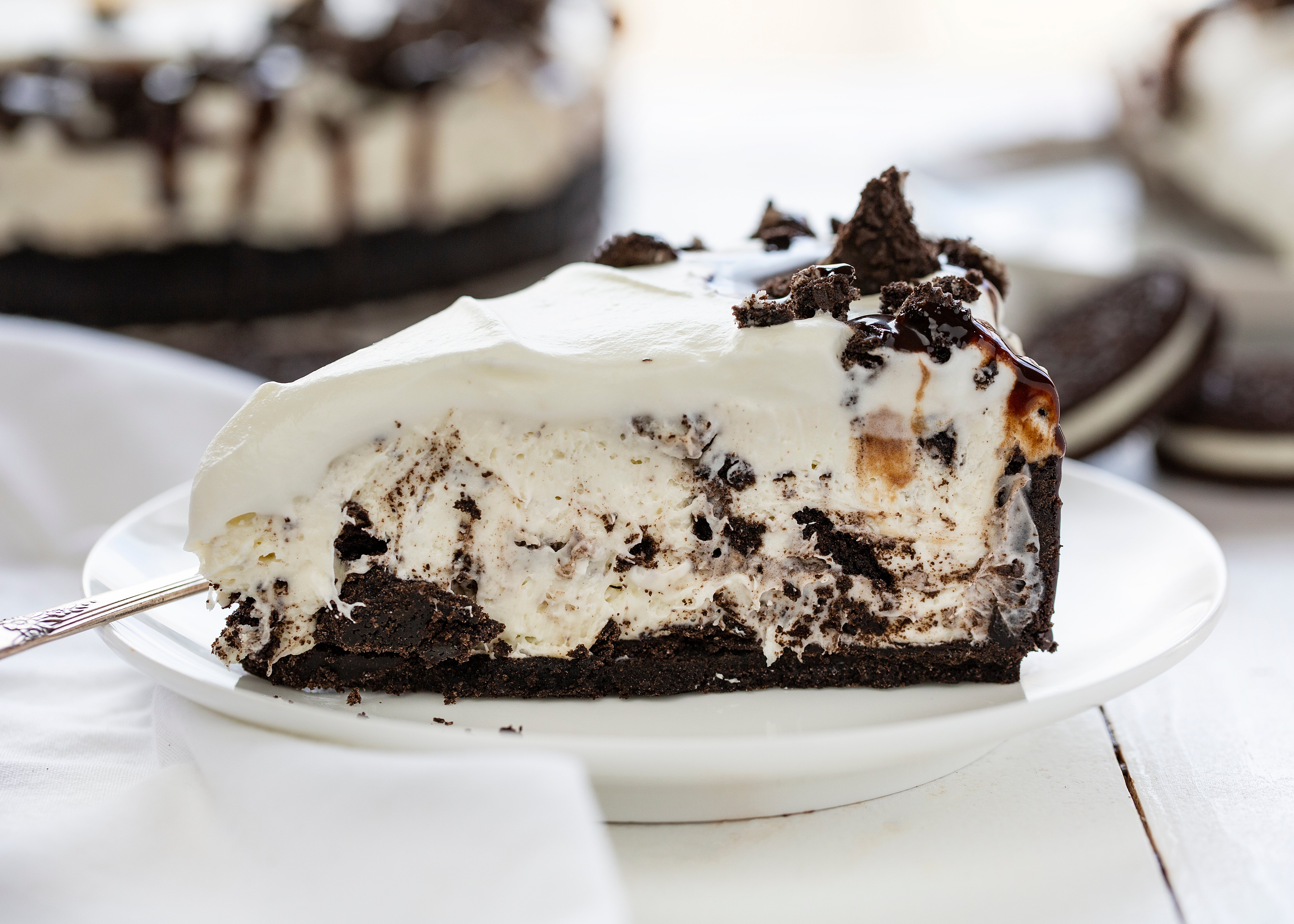 No Bake Oreo Cheesecake is so delicious no one will believe you didnt bake it! no bake, no bake desserts, cheesecake, no bake cheesecake, oreo, oreo cheesecake, no bake oreo cheesecake, iambaker Slice of No Bake Oreo Cheesecake
