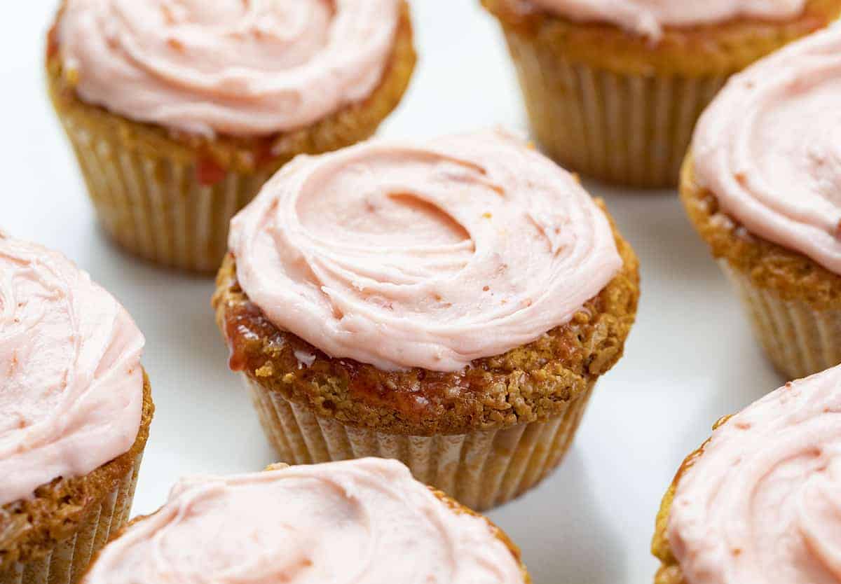 Peanut Butter and Jelly Cupcakes are peanut butter cupcakes topped with a strawberry glaze and covered in sweet, strawberry frosting. PB&J Cupcakes, Peanut Butter Cupcakes, Peanut Butter and Jelly Cupcakes, Jelly frosting, jam frosting, peanut butter & jelly recipes, cupcakes, cupcake recipes, baking, dessert, snacks, popular kids cupcake, i am baker, iambaker, recipes Peanut Butter and Jelly Cupcakes