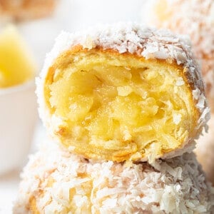 Stacked Pina Colada Bombs with the top Bomb Cut in Half Showing Inside.