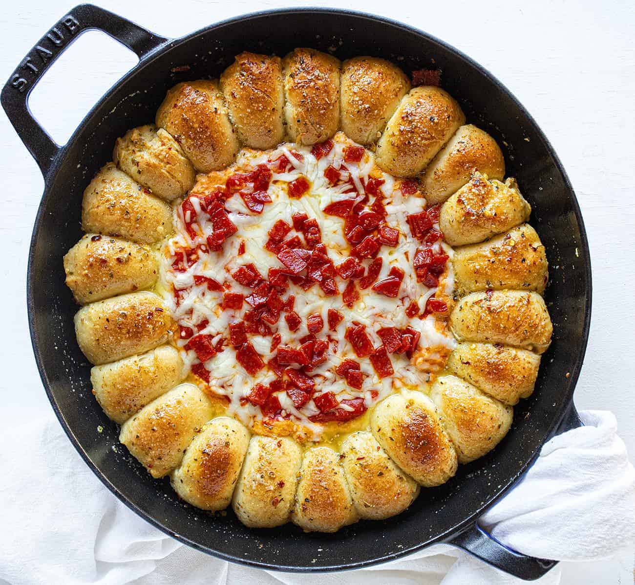 Skillet Pizza Dip combines the deliciousness of garlic bread with a cheesy, pepperoni dip. skillet pizza dip, iambaker, skillet dip, pizza dip, garlic rolls, appetizer, game day appetizer, pizza, dips Skillet Pizza Dip Overhead View