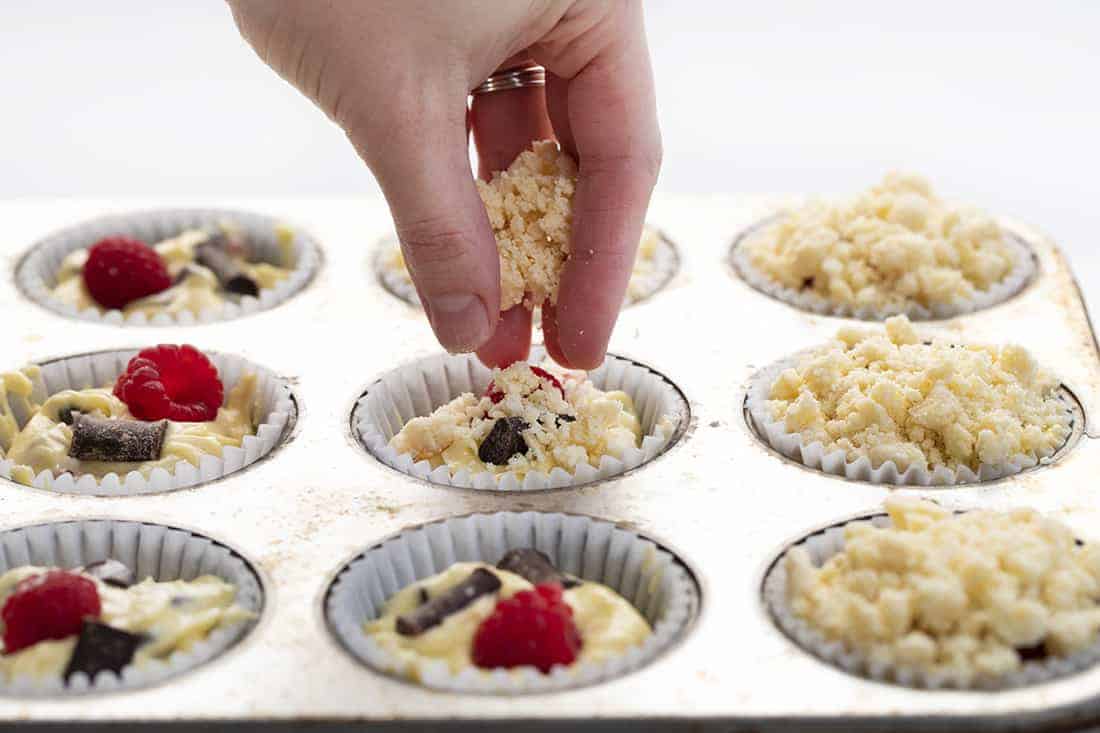 Raspberry Chocolate Muffins are cream cheese muffins loaded with chocolate chunks and fresh raspberries, topped with a buttery crumb topping. Melt in your mouth deliciousness!! Muffins, Bakery Style Muffins, Raspberry Chocolate Muffins, Best Muffins, Muffin Recipes, Raspberry Muffins, Chocolate Muffins, i am baker, iambaker, baking, recipes Adding crumble to Raspberry Chocolate Muffins