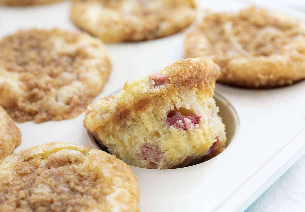 Rhubarb Streusel Muffins are made with cream cheese in the batter for a super moist muffin, with added rhubarb and a streusel topping. Rhubarb Recipes, Baking with Rhubarb, Rhubarb Muffins, Muffin Recipes, Baking, Breakfast, Summer Recipes, i am baker, iambaker Rhubarb Streusel Muffins in Pan with One Almost Out.