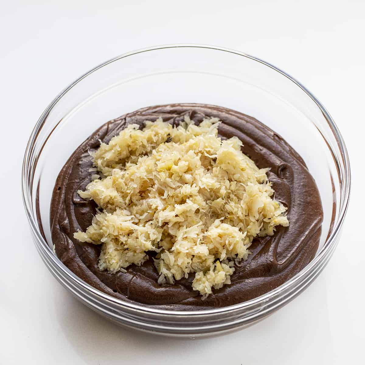 Chocolate Sauerkraut Cake is a soft and moist chocolate cake topped with a thick and creamy chocolate frosting. Chocolate Cake, Sauerkraut Cake, Chocolate Sauerkraut Cake, Vintage Cake, Old Fashioned Cake, Grandma's Chocolate Cake, Baking, Dessert, Chocolate Frosting, recipes, i am baker, iambaker Raw Chocolate Cake Batter with Sauerkraut In it Before Stirring.