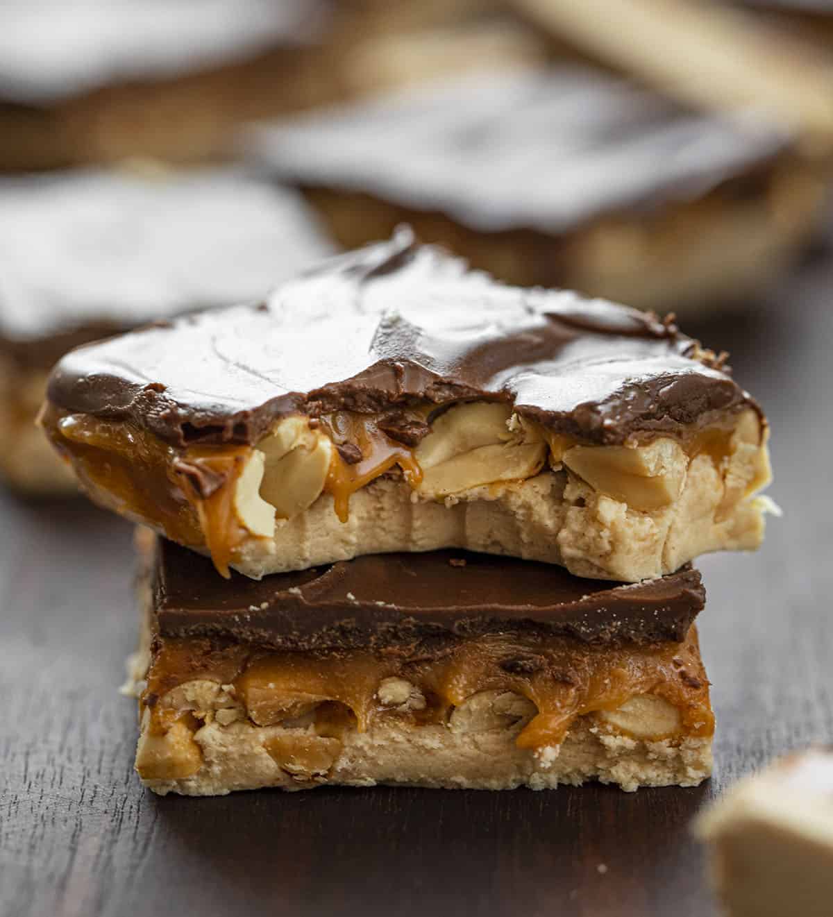 Homemade Snickers is one supersized Snickers bar made with a creamy nougat layer, nutty caramel layer, and a top layer of chocolate. Snickers, Homemade Candy Bars, Candy Bars, Chocolate, Nougat, Peanuts, dessert, snacks, recipes, no bake dessert, i am baker, iambaker But Into Homemade Snickers Bar