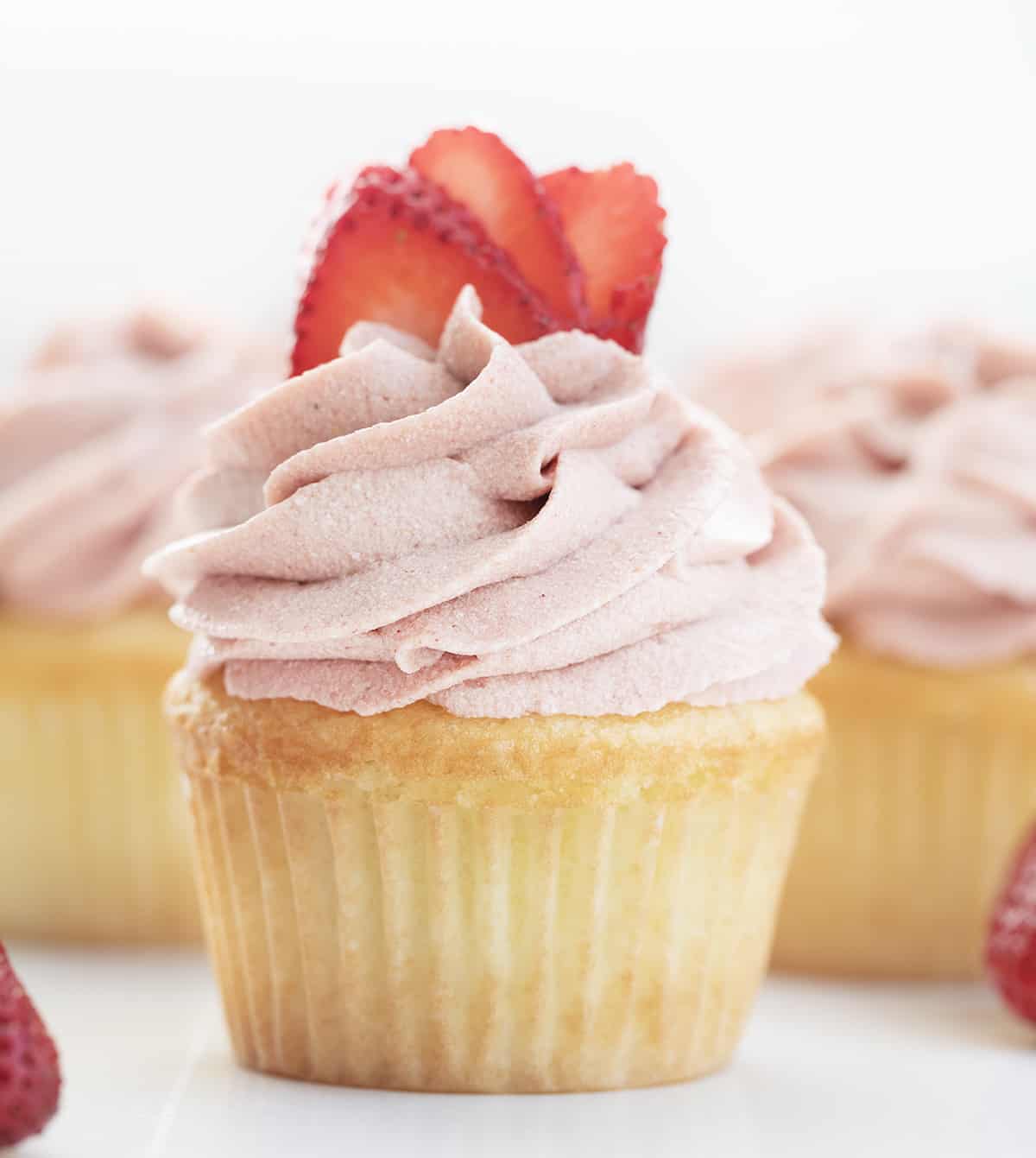 Strawberry Ermine Frosting (or a version of $300 frosting) is a luscious frosting made with a cooked flour and milk mixture added to butter, sugar, and freeze-dried strawberry powder. Also known as milk frosting, flour buttercream, or flour frosting, it has a silky smooth texture with the taste of real strawberries in every bite. Strawberry Ermine Frosting Piped on a Cupcake with Strawberries.