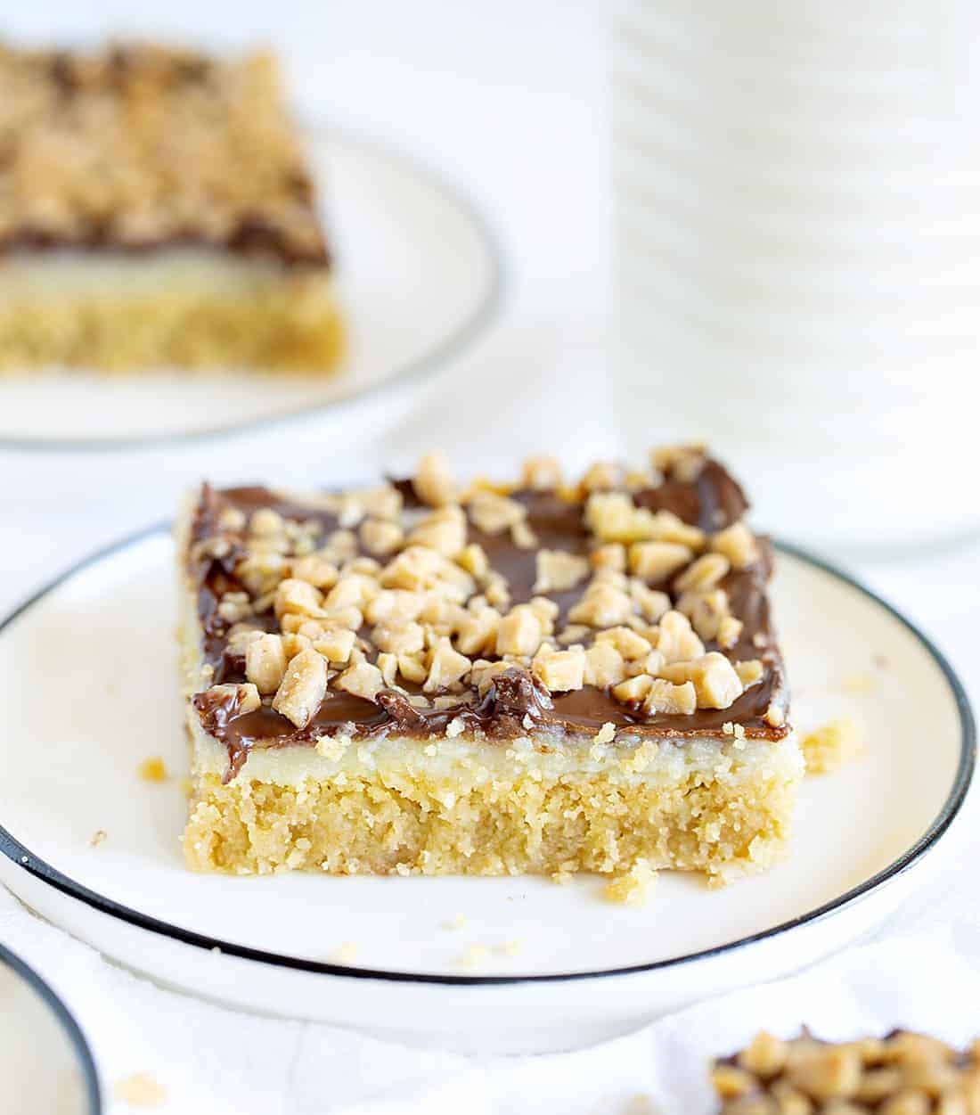 Chocolate Toffee Bars are a gooey delight with layers of flavor and satisfaction! iambaker, chocolate toffee bar, baking, desserts, chocolate toffee, toffee, dessert bars Piece of Chocolate Toffee Bars