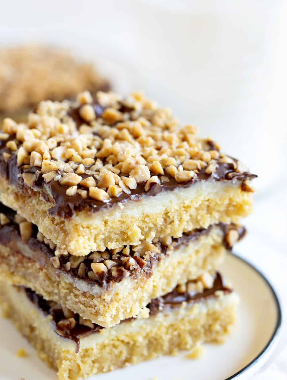 Chocolate Toffee Bars are a gooey delight with layers of flavor and satisfaction! iambaker, chocolate toffee bar, baking, desserts, chocolate toffee, toffee, dessert bars Chocolate Toffee Bars Stacked