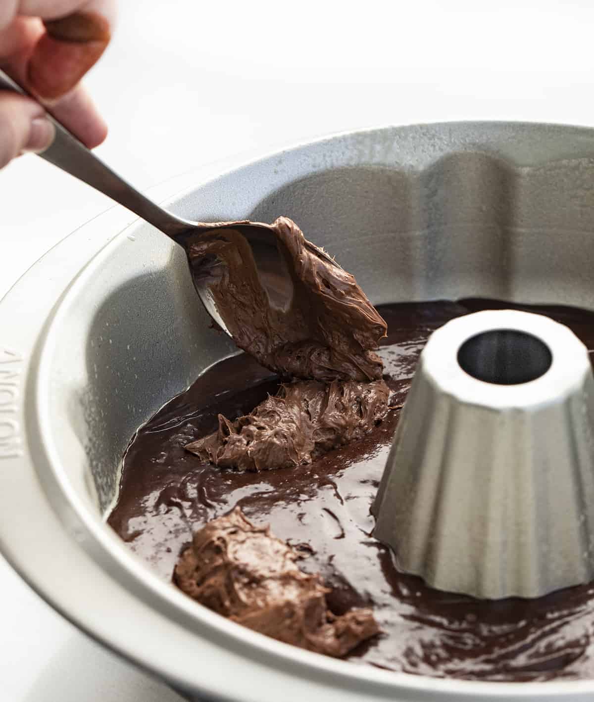 Death By Chocolate Bundt Cake is a chocolate cake with a chocolate cream cheese filling baked in a bundt pan and then topped with chocolate butter ganache. Chocolate Bundt, Triple Chocolate Bundt, Chocolate Cheesecake Chocolate Bundt, Death by Chocolate Bundt Cake, Butter Chocolate Ganache, How to Make Ganache with Just Butter, Chocolate Cream Cheese, Dessert, Baking, Decadent Dessert, Holiday Dessert, Christmas Dessert, New Years Dessert, i am baker, iambaker Adding Chocolate Cream Cheese to Chocolate Fudge Bundt Cake Pan