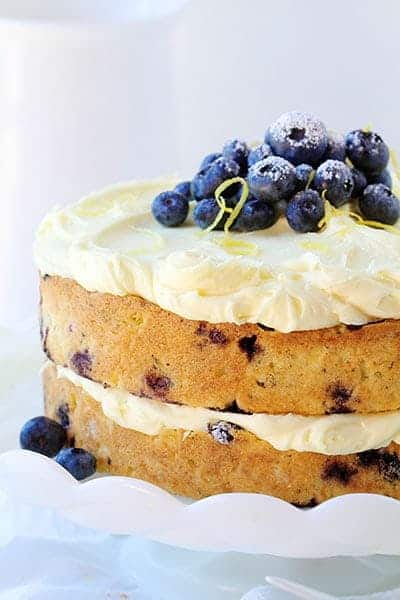 THIS is the dessert of the summer! Perfect infusion of lemon and blueberry and my secret ingredient that makes it over-the-top moist! #iambaker #lemoncake #lemonblueberrycake #baking #summer #desserts #bbq Lemon Blueberry Cake Recipe