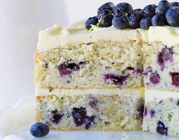 THIS is the dessert of the summer! Perfect infusion of lemon and blueberry and my secret ingredient that makes it over-the-top moist! #iambaker #lemoncake #lemonblueberrycake #baking #summer #desserts #bbq Lemon Blueberry Cake