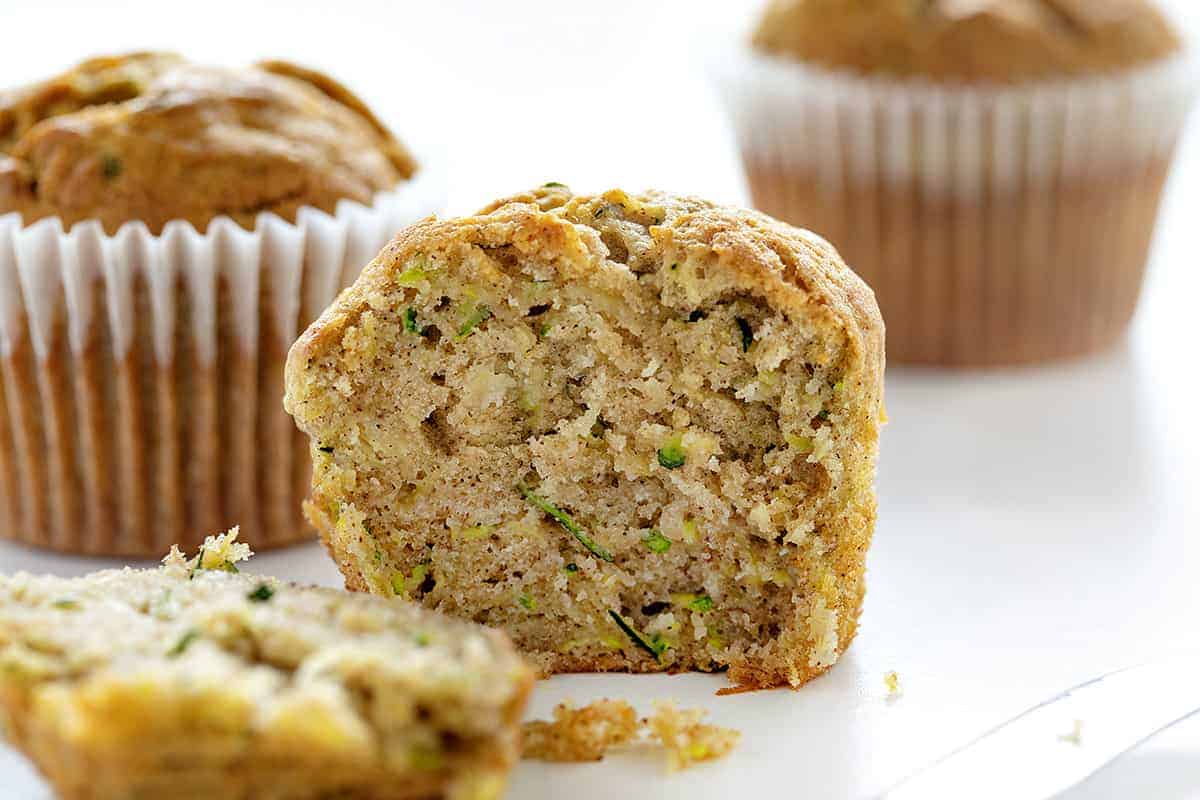 Banana Zucchini Muffins are so moist and delicious, you will never think of buying a muffin again! banana zucchini muffins, zucchini muffins, banana muffins, homemade muffins, iambaker, baking, muffins, bananas, zucchini recipes Cut into Banana Zucchini Muffin